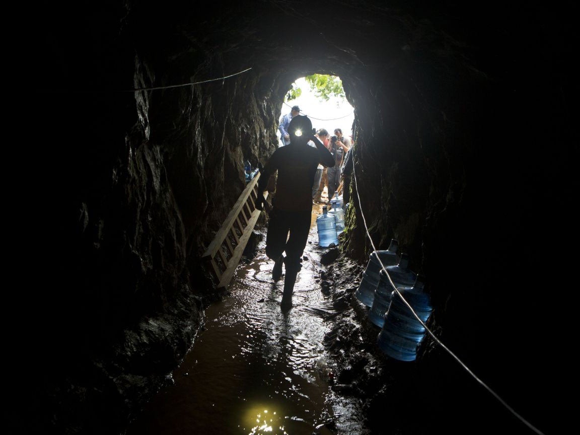 A miner enters the El Comal gold and silver mine to help with rescue operations after the landslide