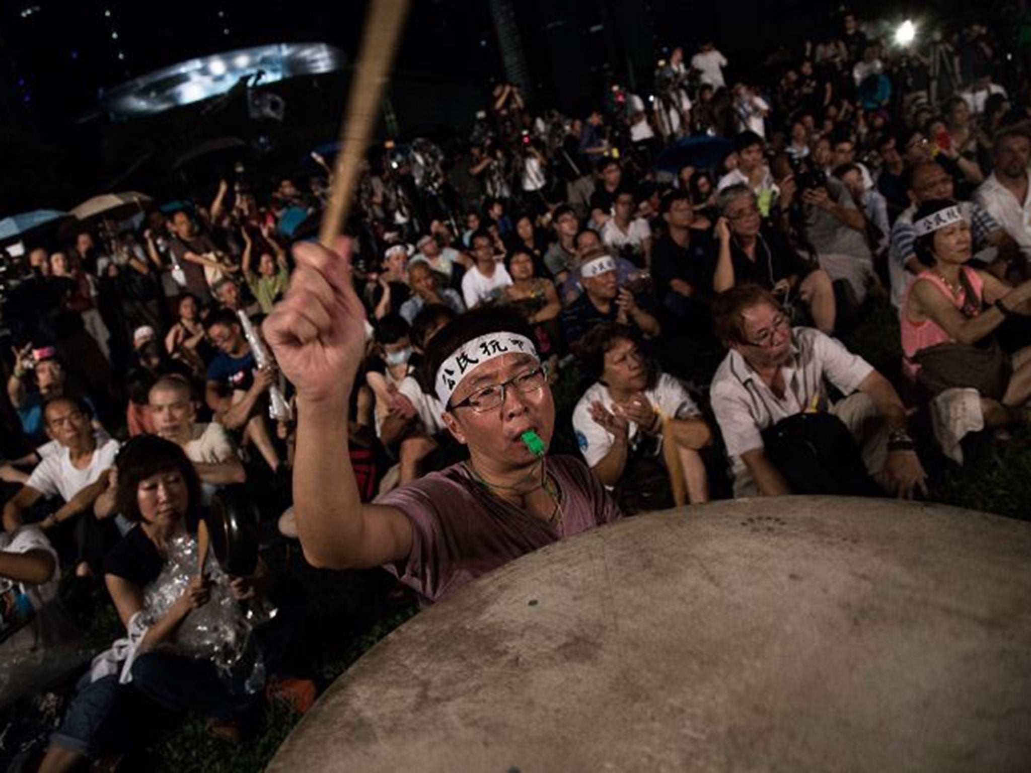 Supporters of the Occupy Central movement protesting outside government offices in Hong Kong yesterday to oppose the framework for the 2017 chief executive election. China has said it will tightly control the nomination of candidates for the political pos