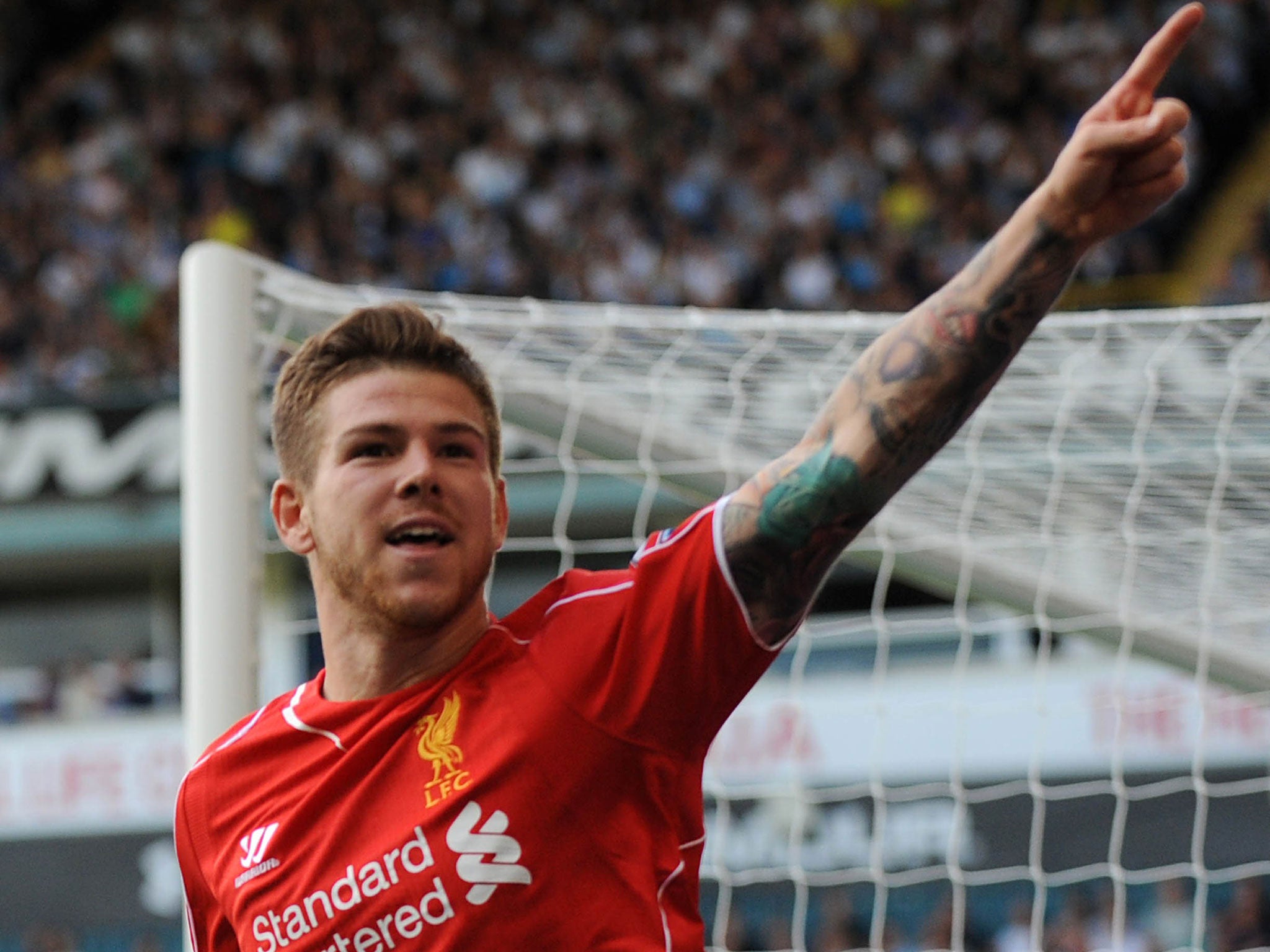 Alberto Moreno celebrates his wonder-goal to make it 3-0