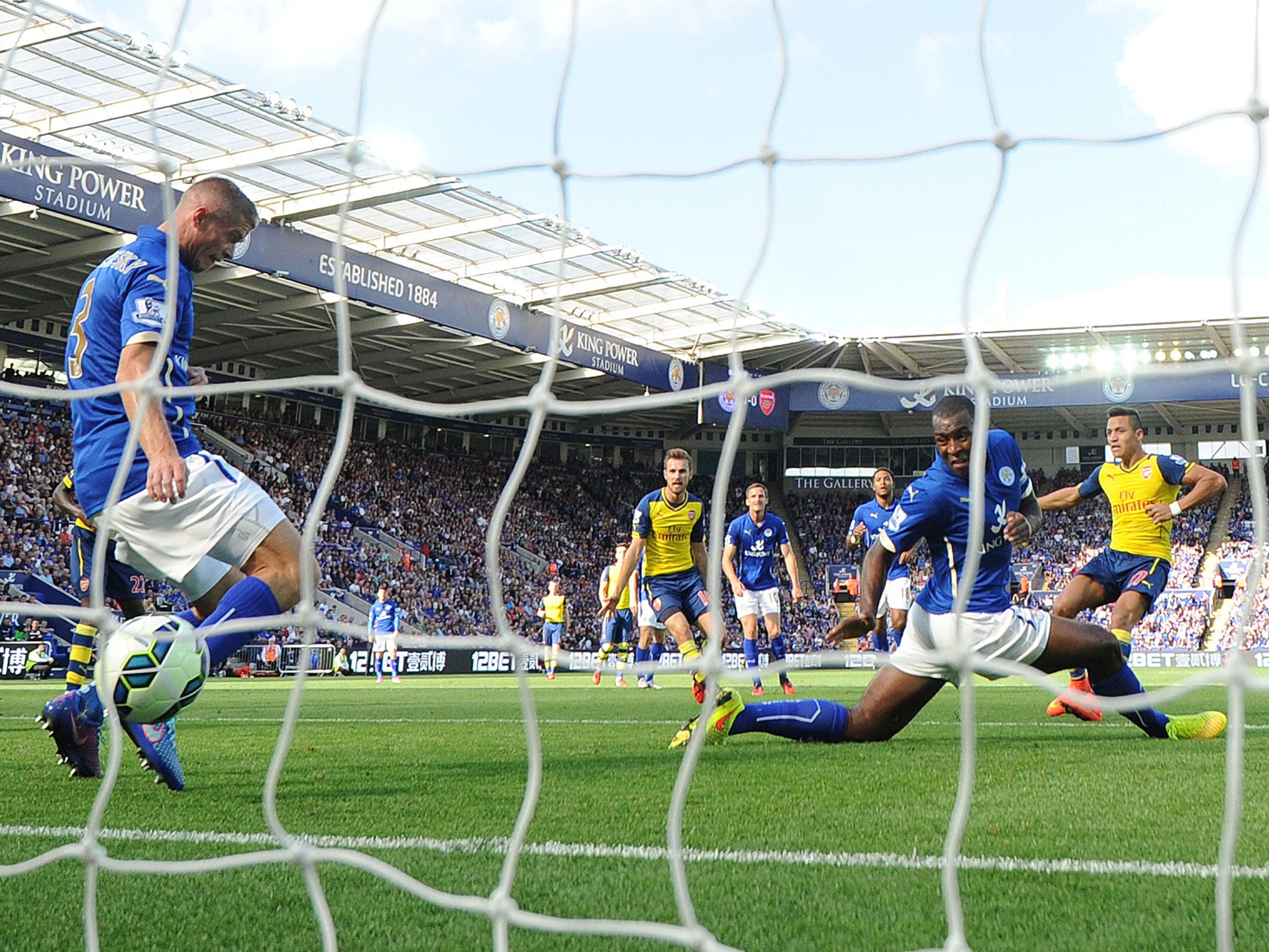 Alexis Sanchez (right) scores his first Premier League goal