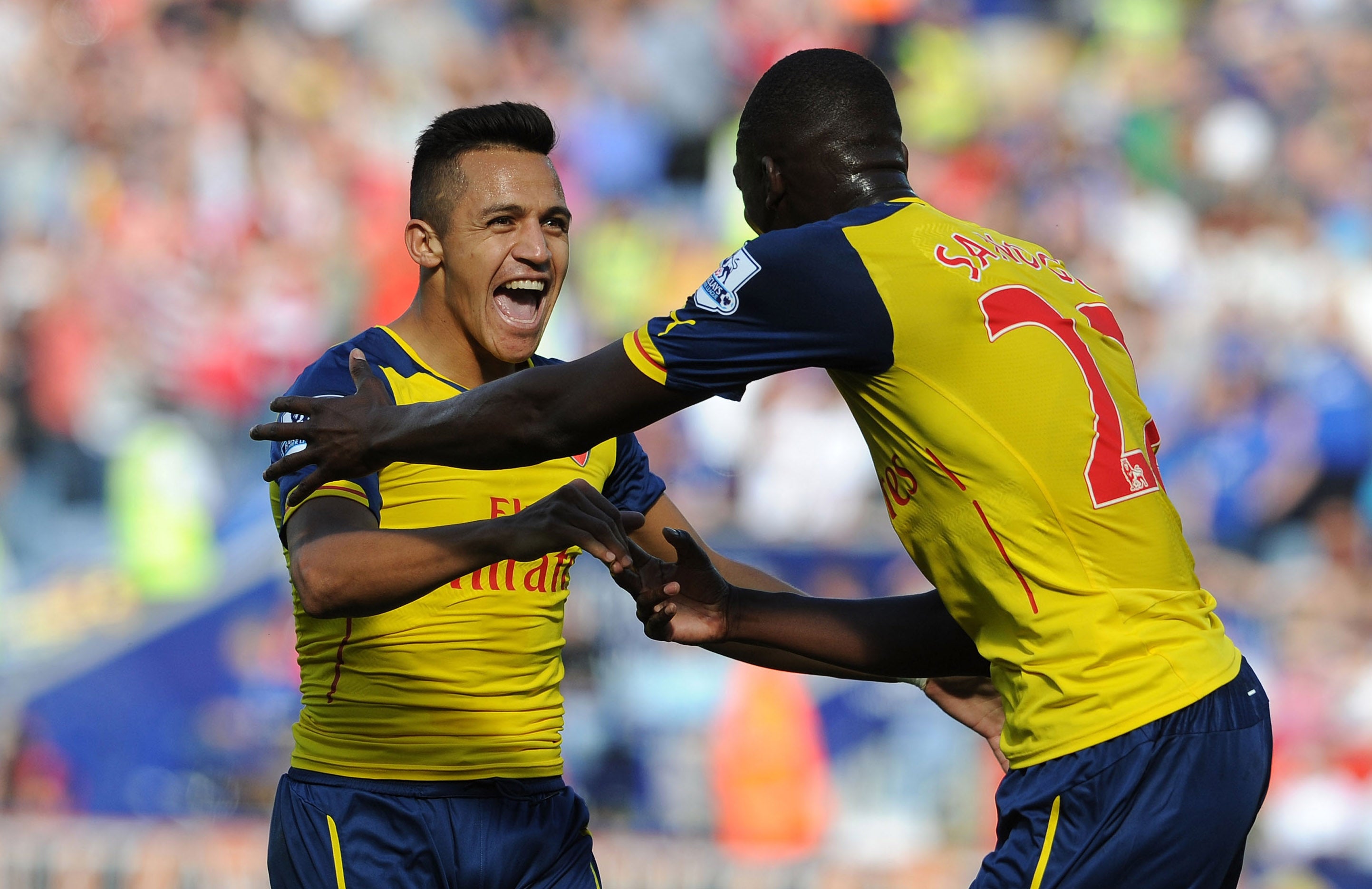 Alexis Sanchez celebrates his first Premier League goal