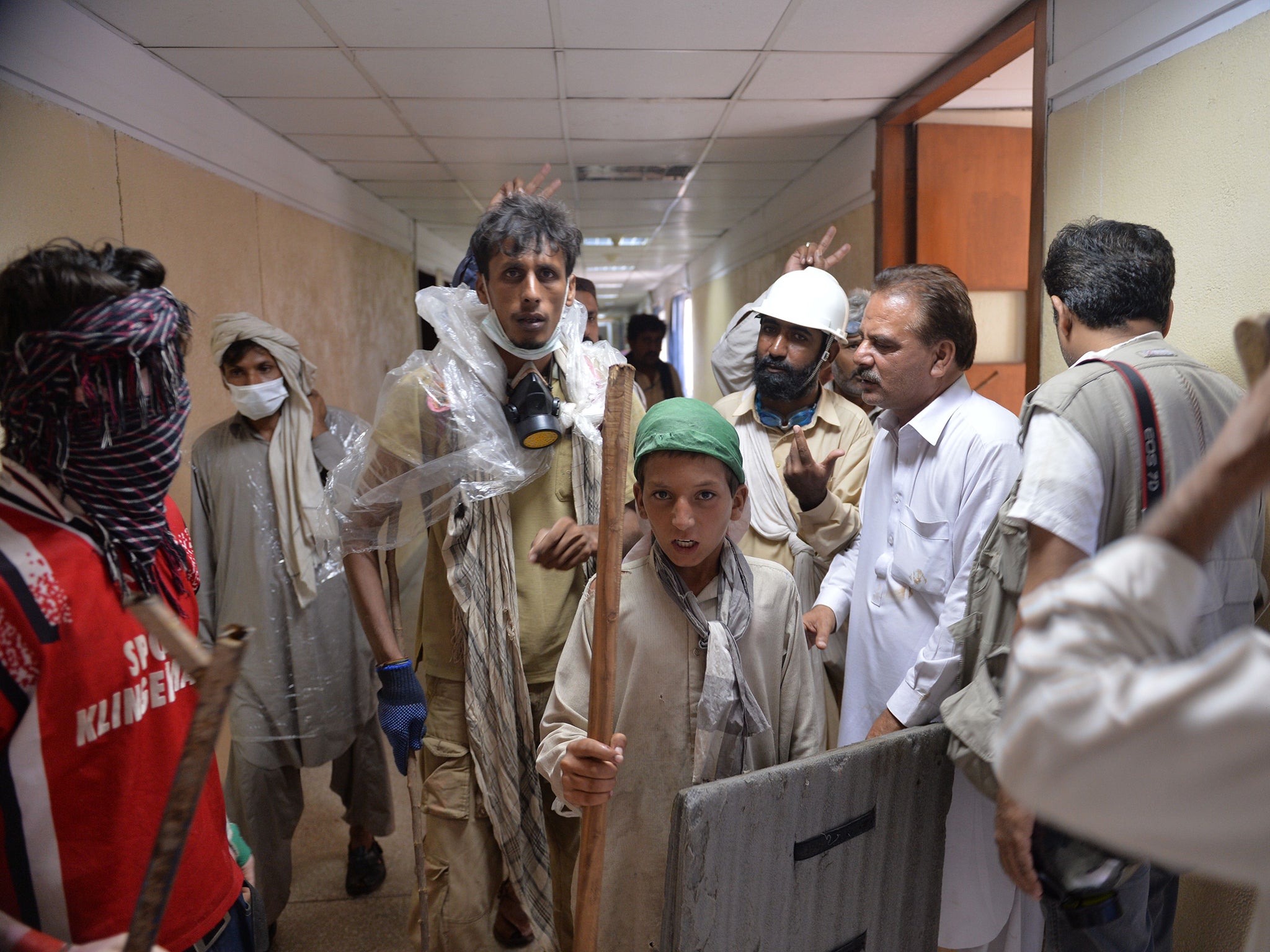 Supporters of Imran Khan enter the headquarters of the state owned Pakistani Television (PTV)