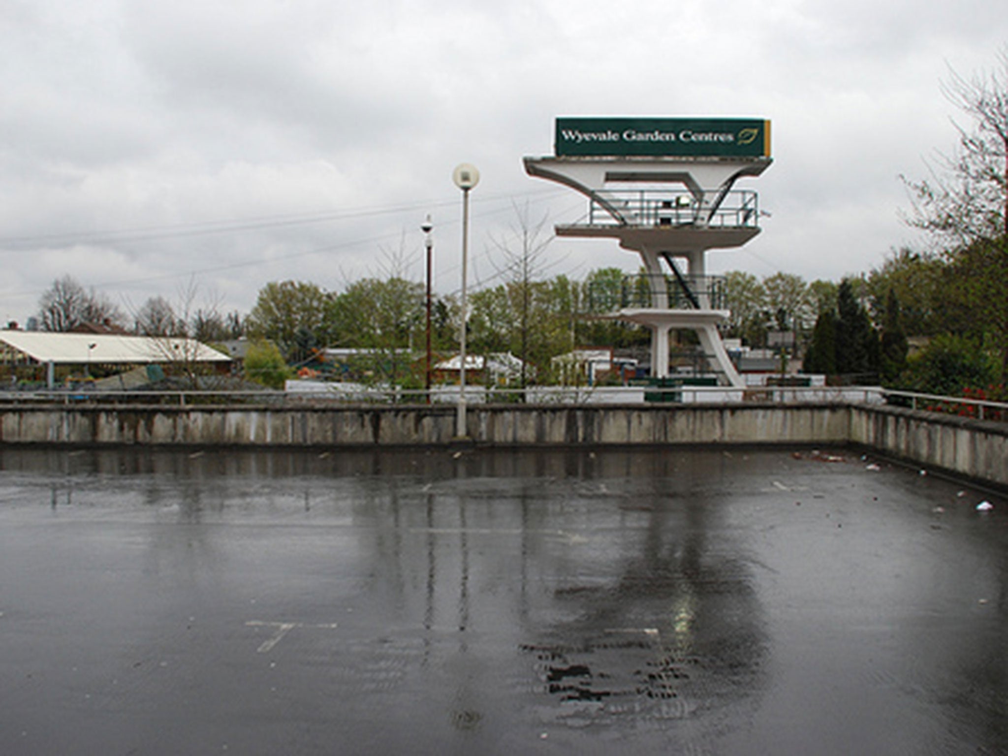The multi-level concrete diving stage now stands in a garden centre