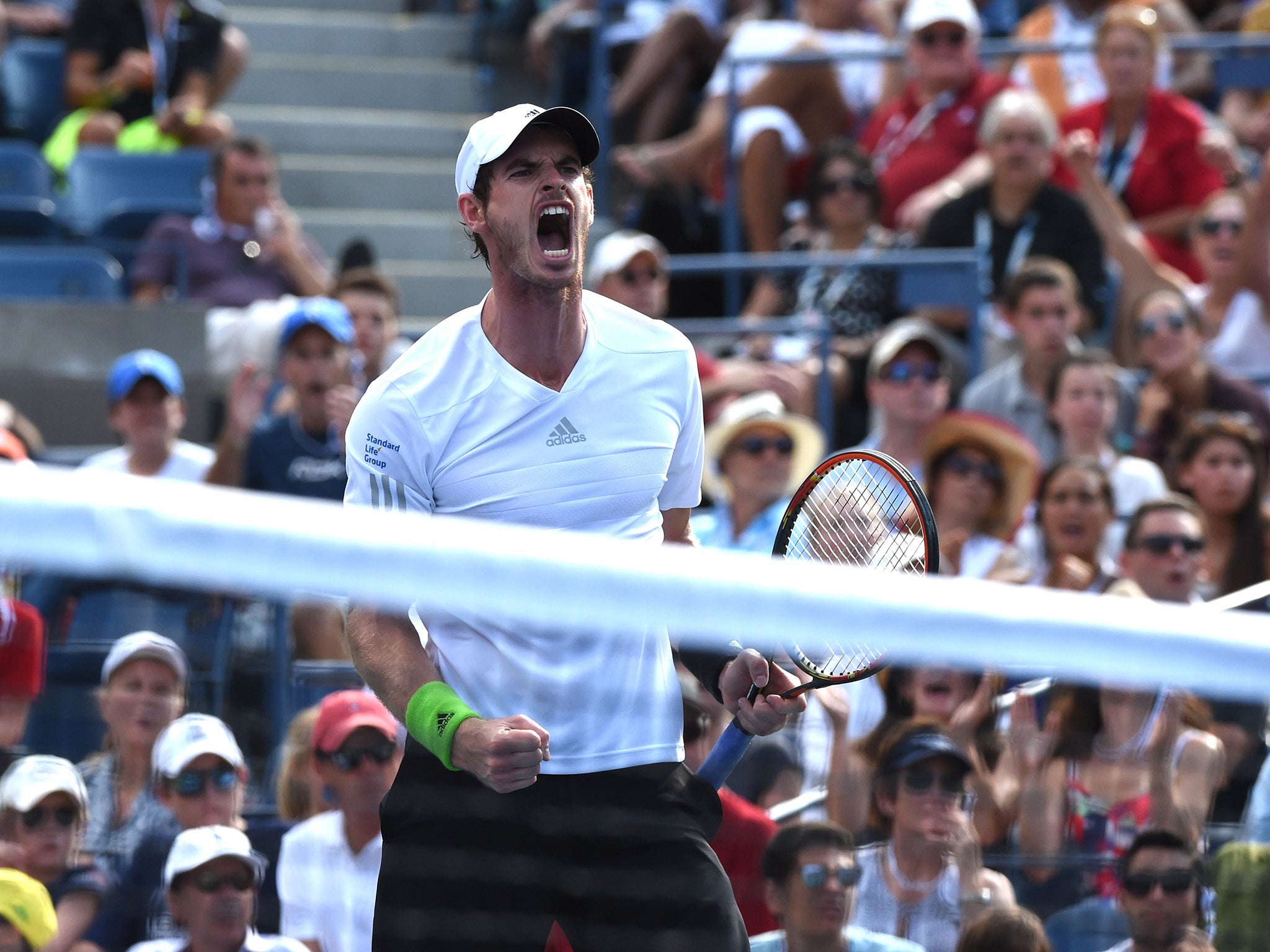 Andy Murray celebrates a shot while playing Jo-Wilfried Tsonga