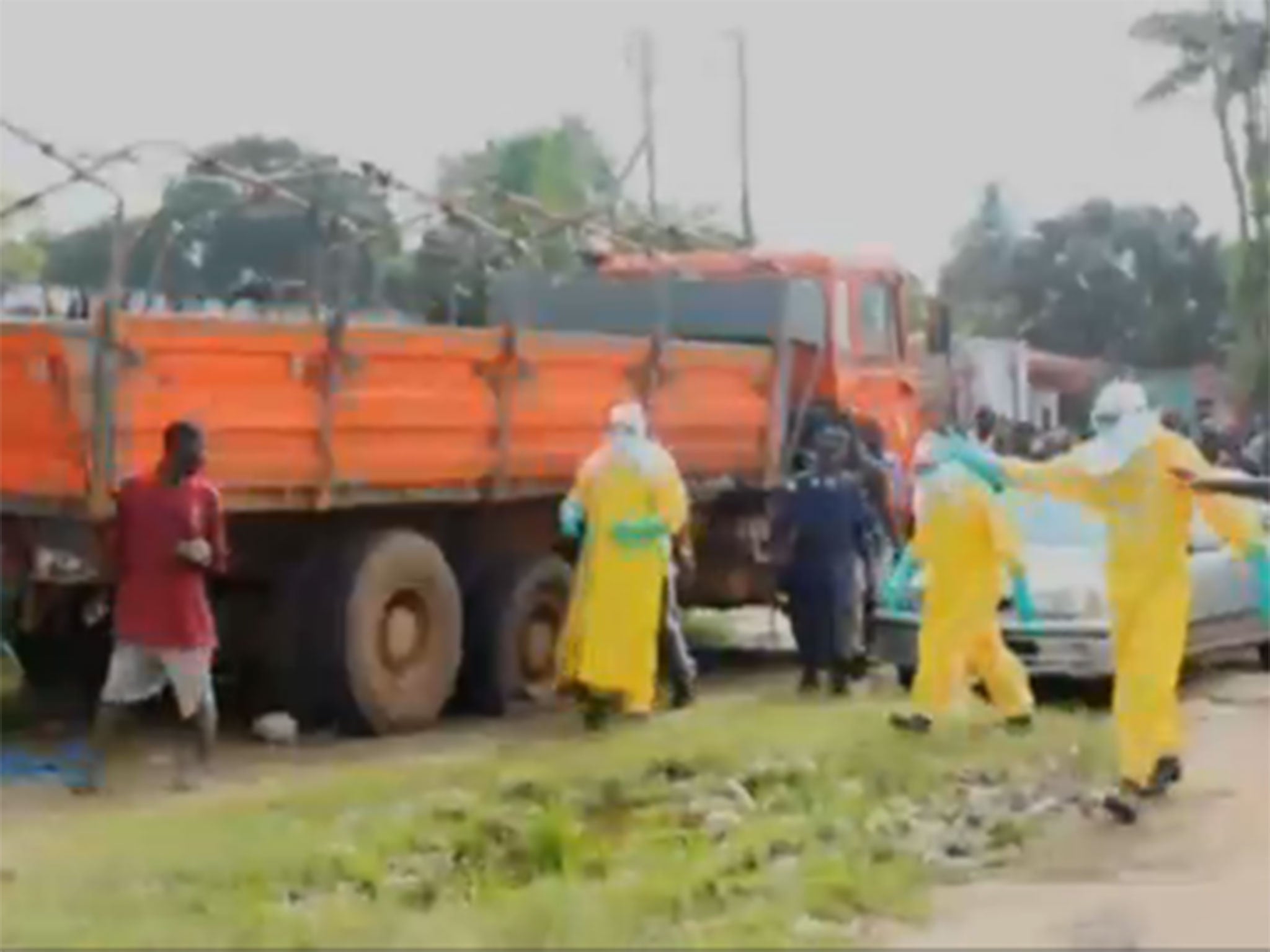 He was confronted by health workers wearing protective clothing