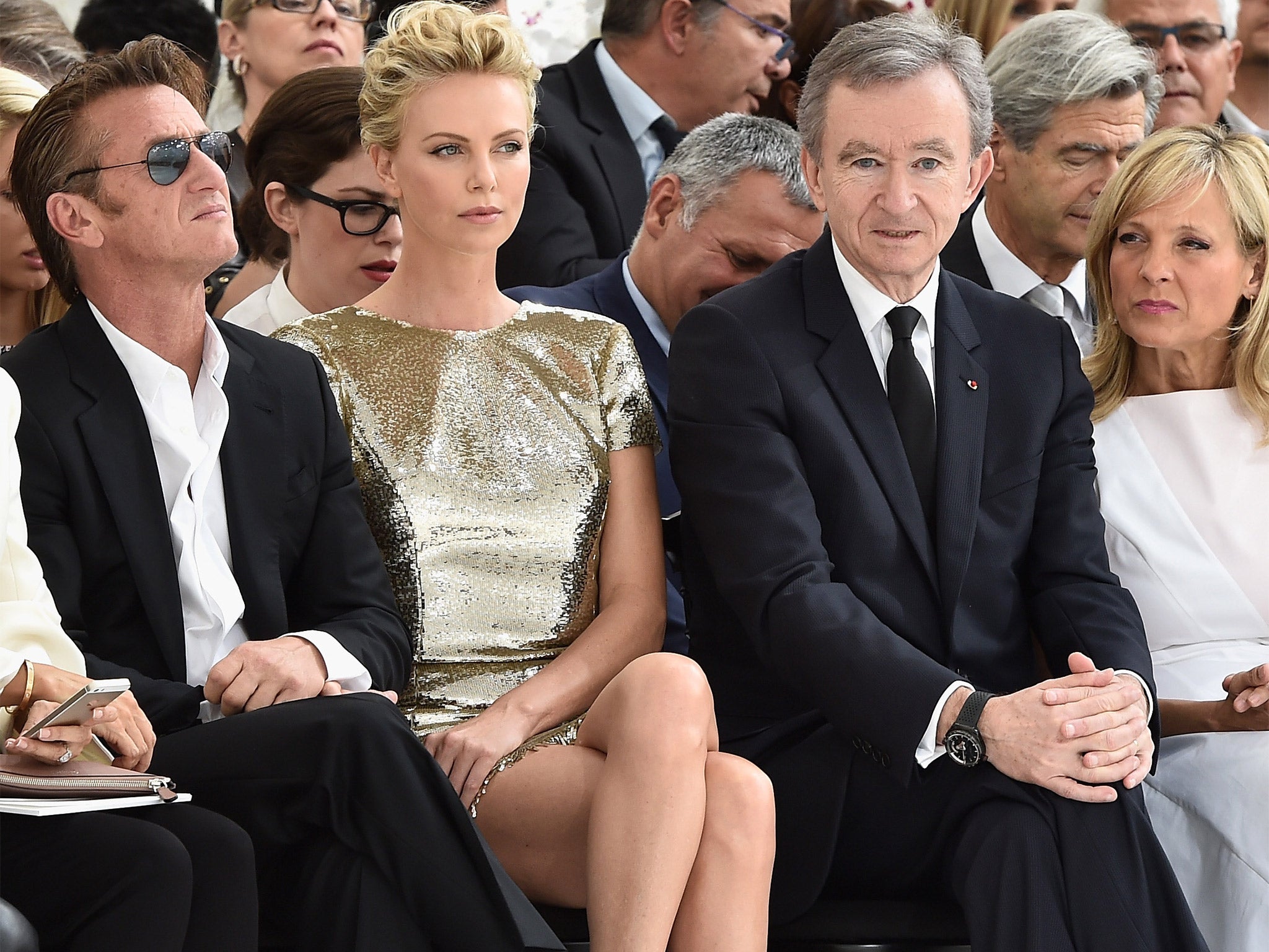 Actors Sean Penn (left) and Charlize Theron joined Bernard Arnault and wife Helene at this year’s Paris Fashion Week