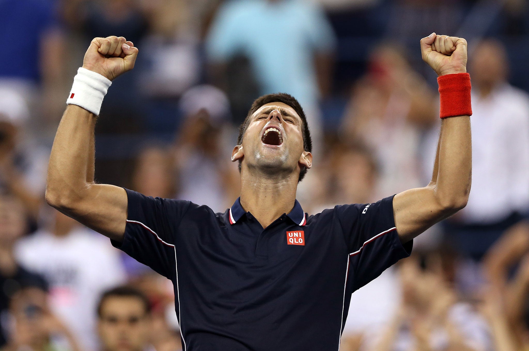 Novak Djokovic of Serbia celebrates after defeating Andy Murray of Great Britain in their men's singles quarterfinal match on Day Ten of the 2014 US Open