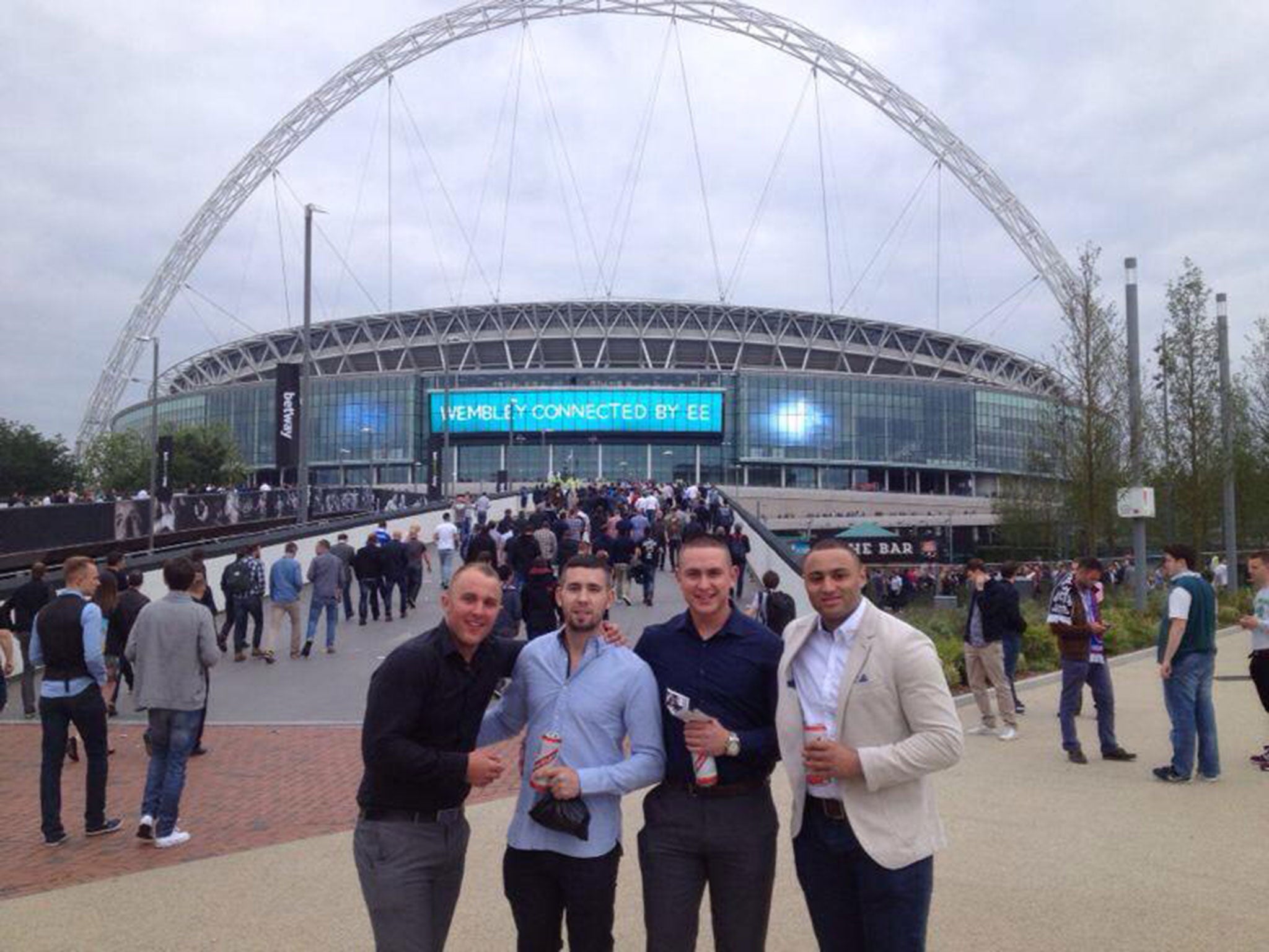 Luke (far right) posted this picture outside Wembley Stadium last month alongside friends on the day of the Community Shield