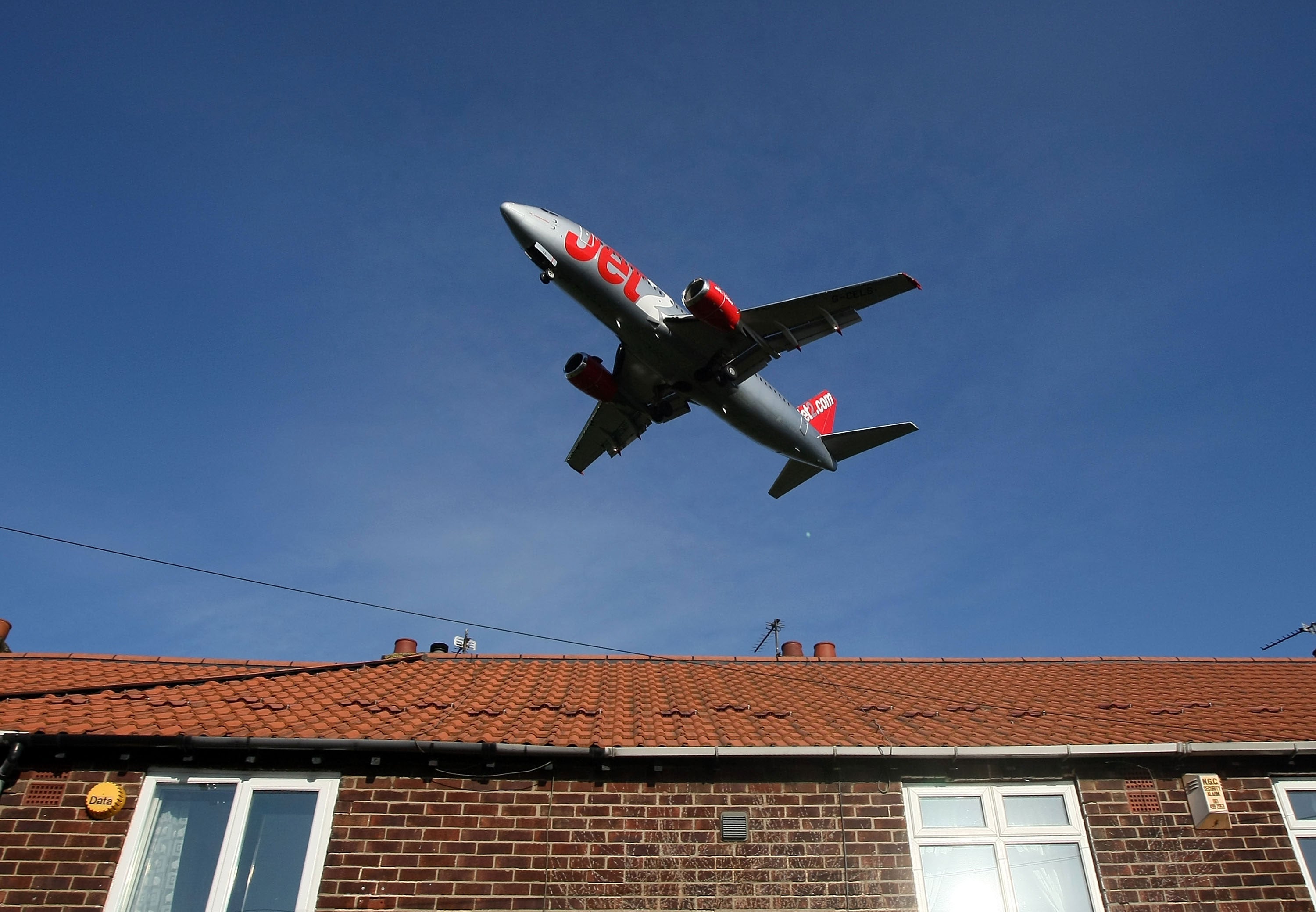 A Jet2 passenger aircraft landing at Manchester International Airport approaches the runway on 28 January, 2008, Manchester, England. Baggage handlers at the airport are facing job losses after management at Ringway Handling Services say they may close t