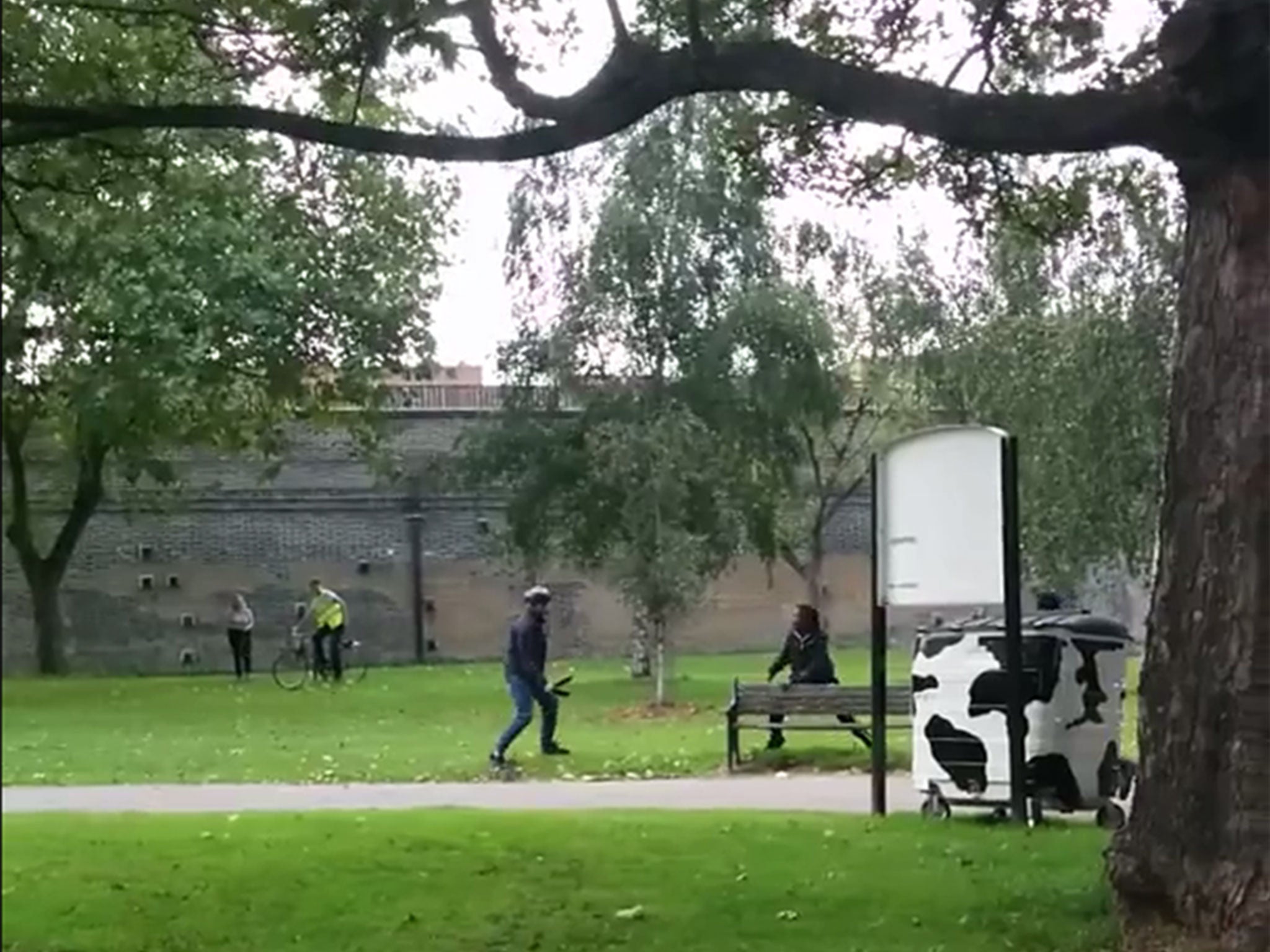 A group of youths argue in Stonebridge Gardens, Haggerstone, east London