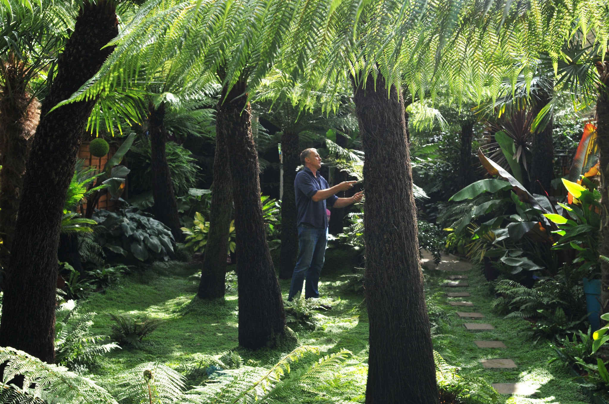 Patrick de Nangle tending his garden
