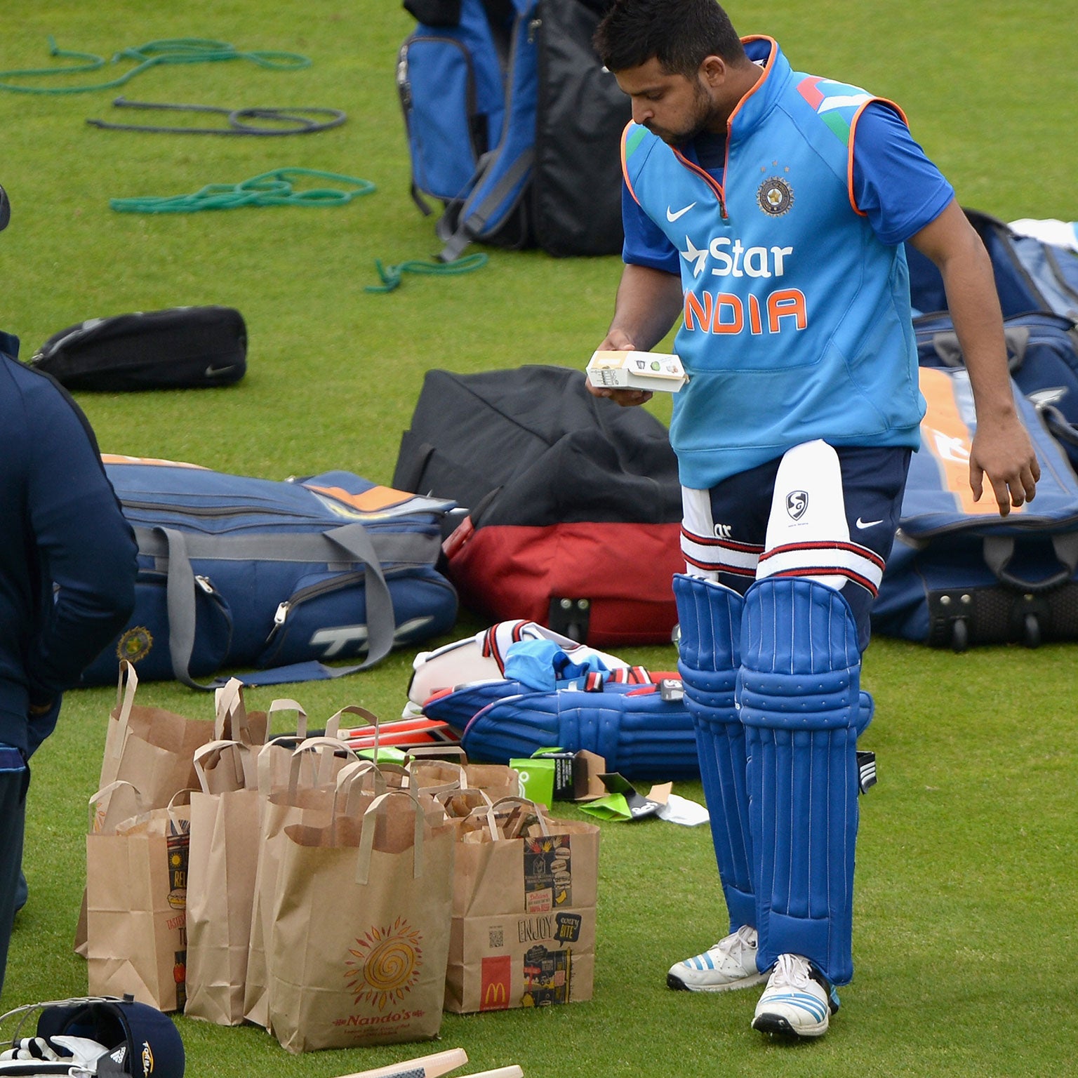 Suresh Raina grabs some lunch during nets