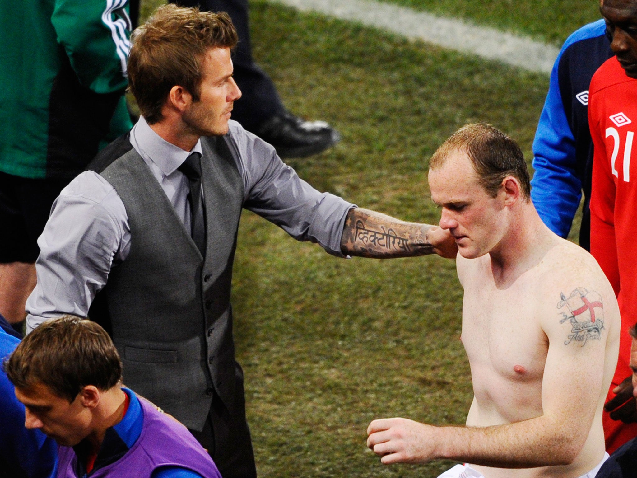 David Beckham consoles Wayne Rooney during the 2010 European Championships