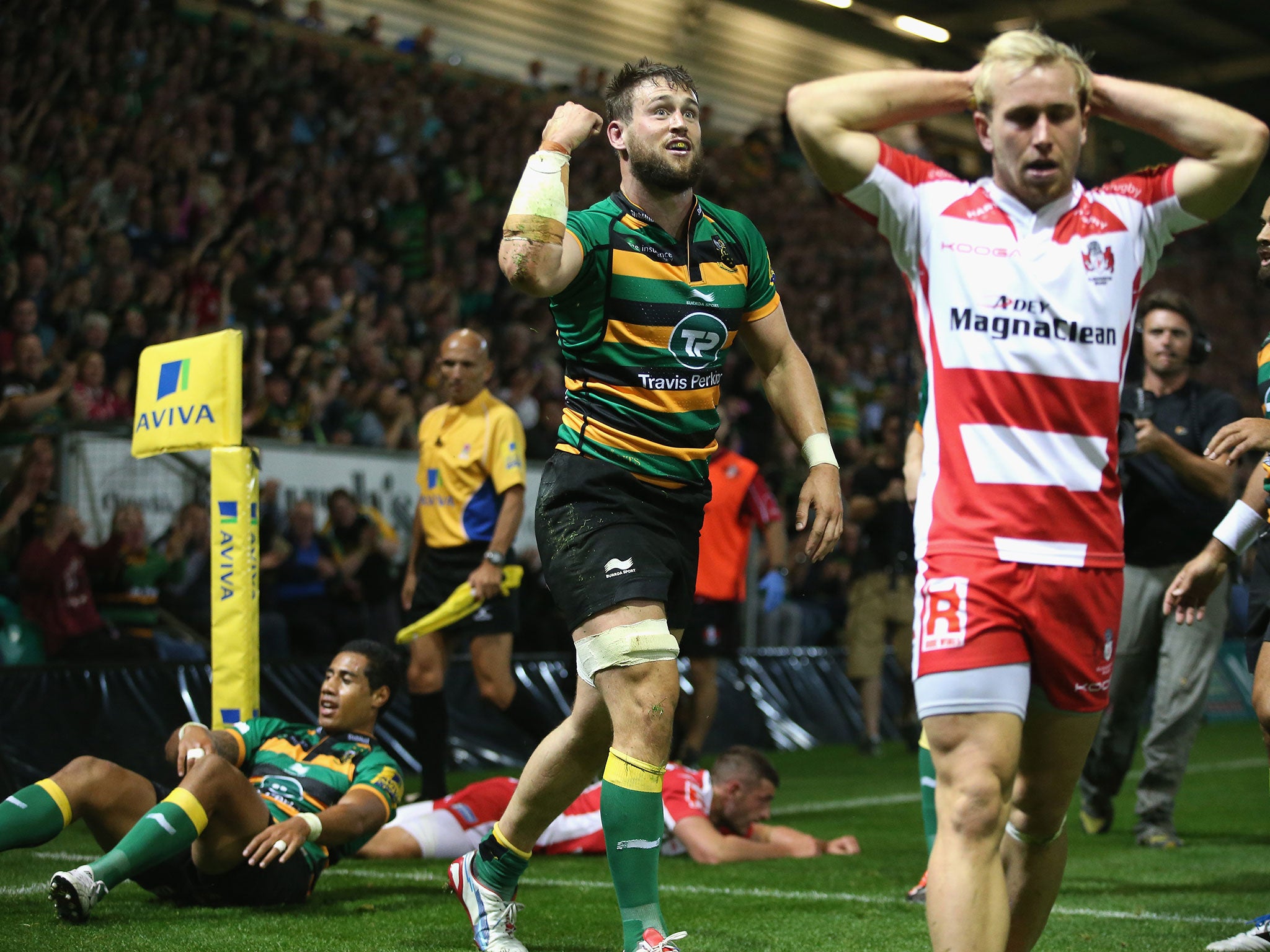 Jon Fisher of Northampton celebrates after scoring their sixth try