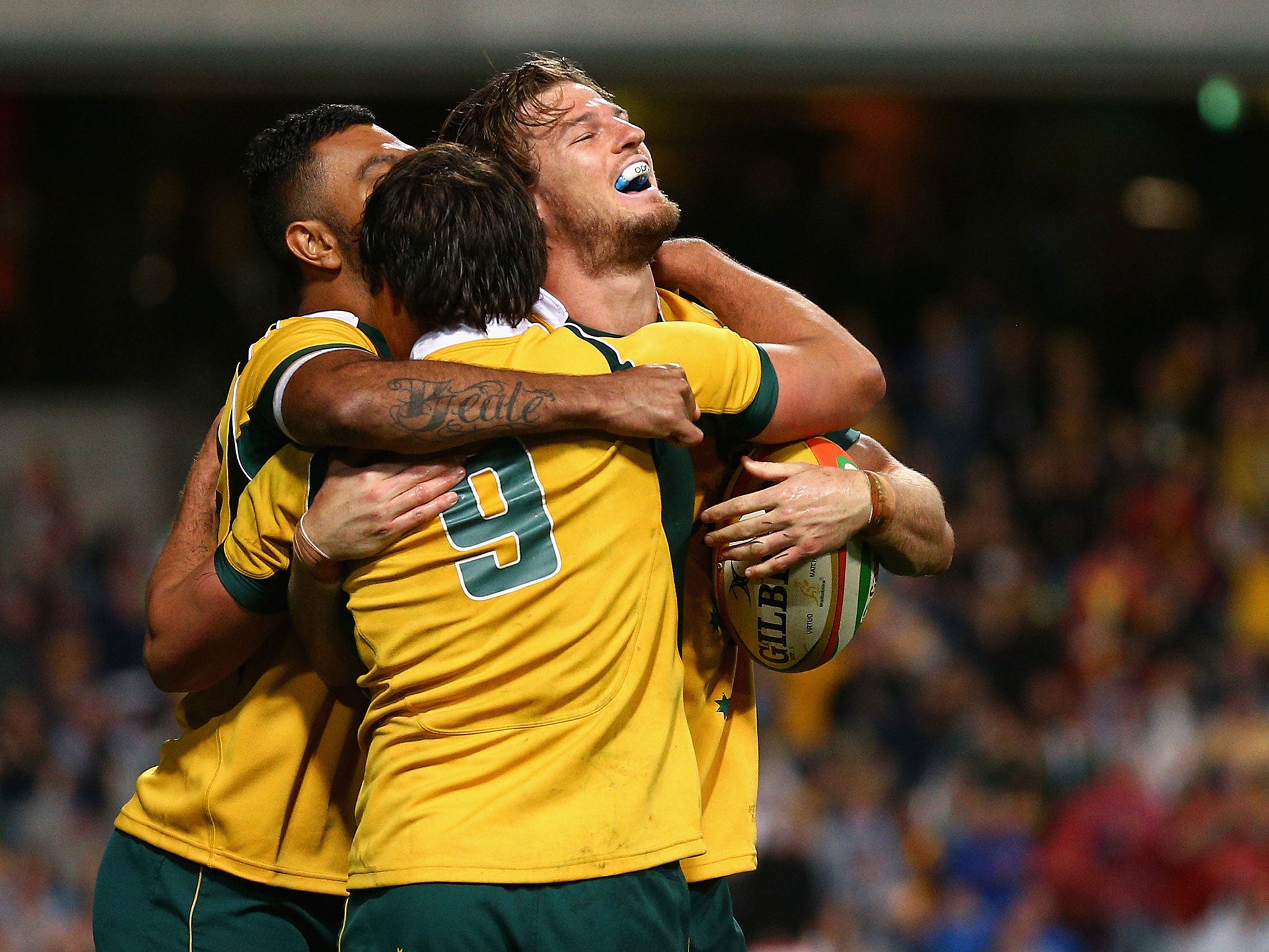 Australia celebrate Horne's late match-winning try against South Africa