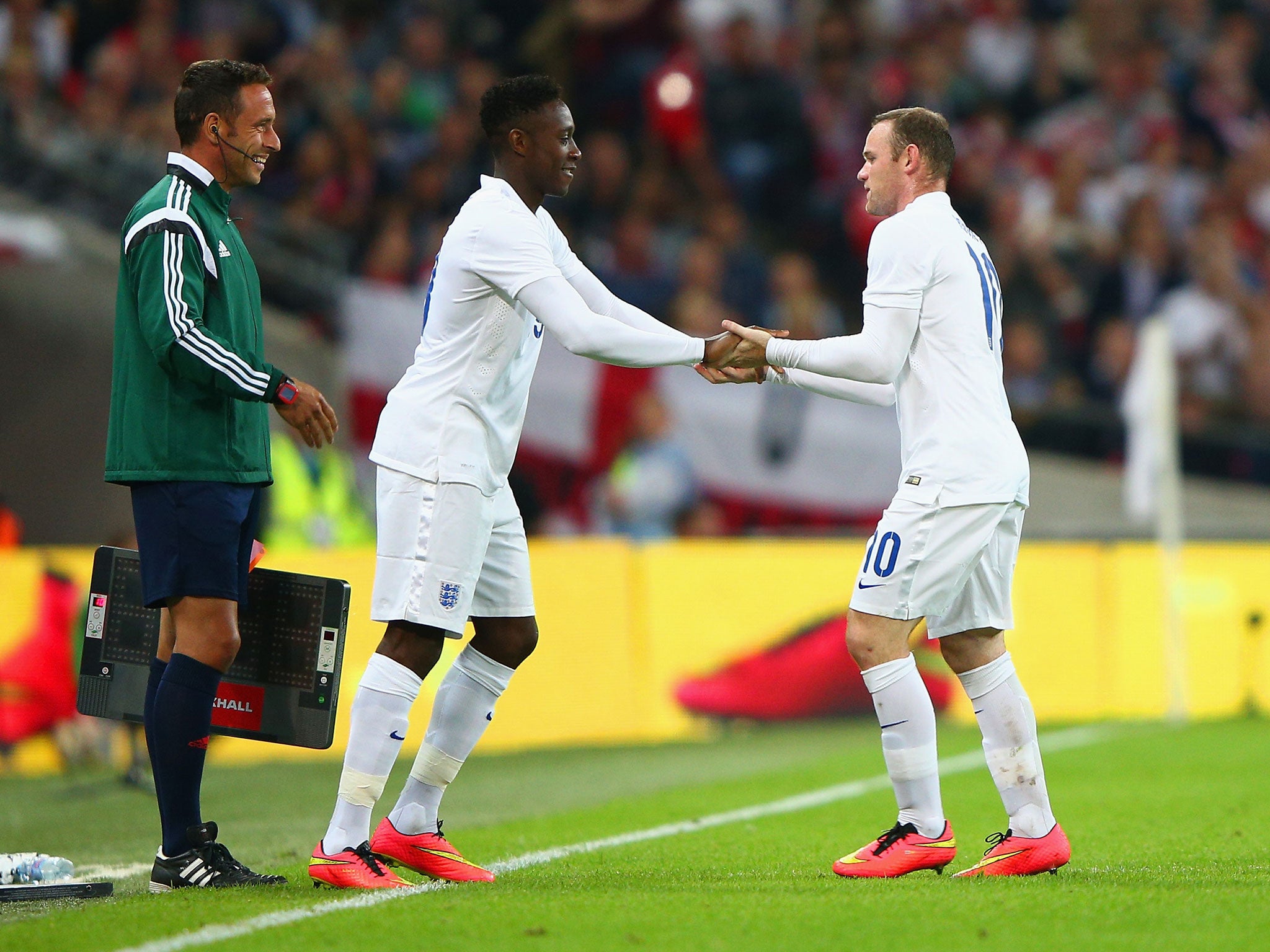 Wayne Rooney shakes hands with Danny Welbeck as he is replaced during England's 1-0 win over Norway