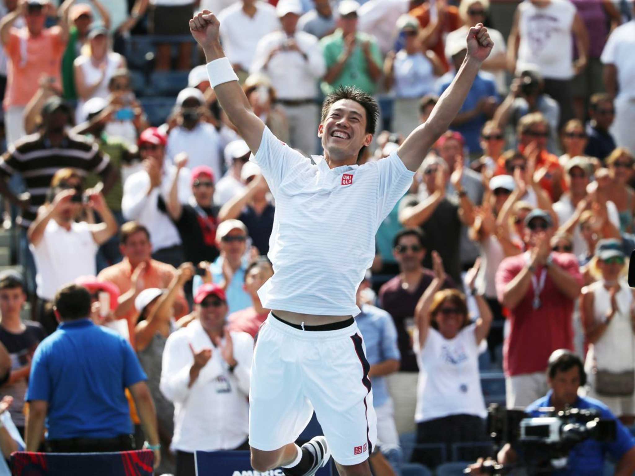 Kei Nishikori, of Japan, reacts after defeating Novak Djokovic in 2014