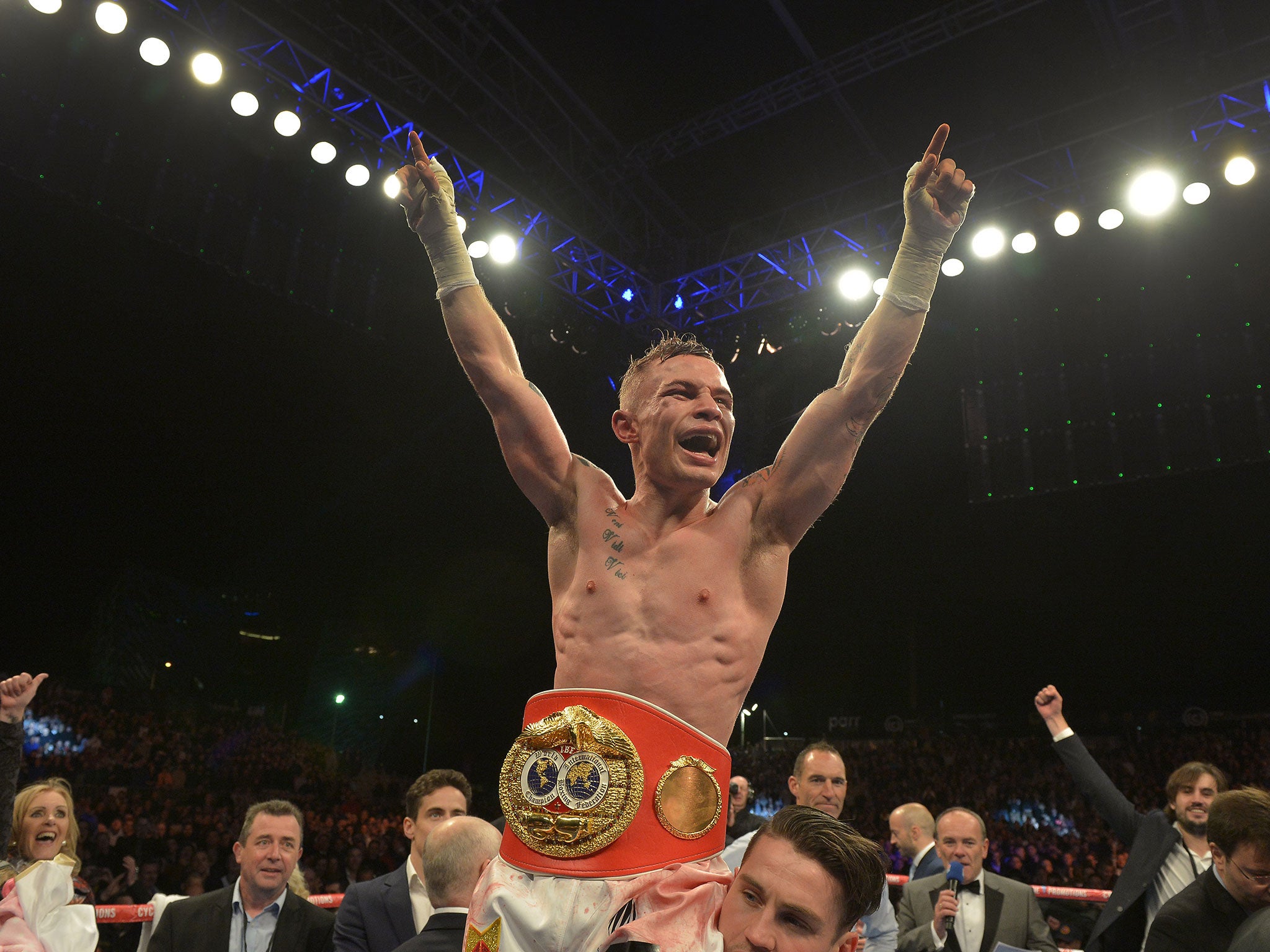 Carl Frampton celebrates after winning the IBF title