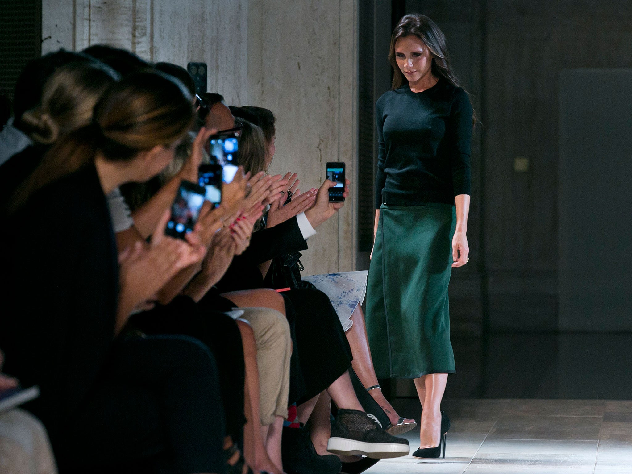 Designer Victoria Beckham acknowledges audience applause