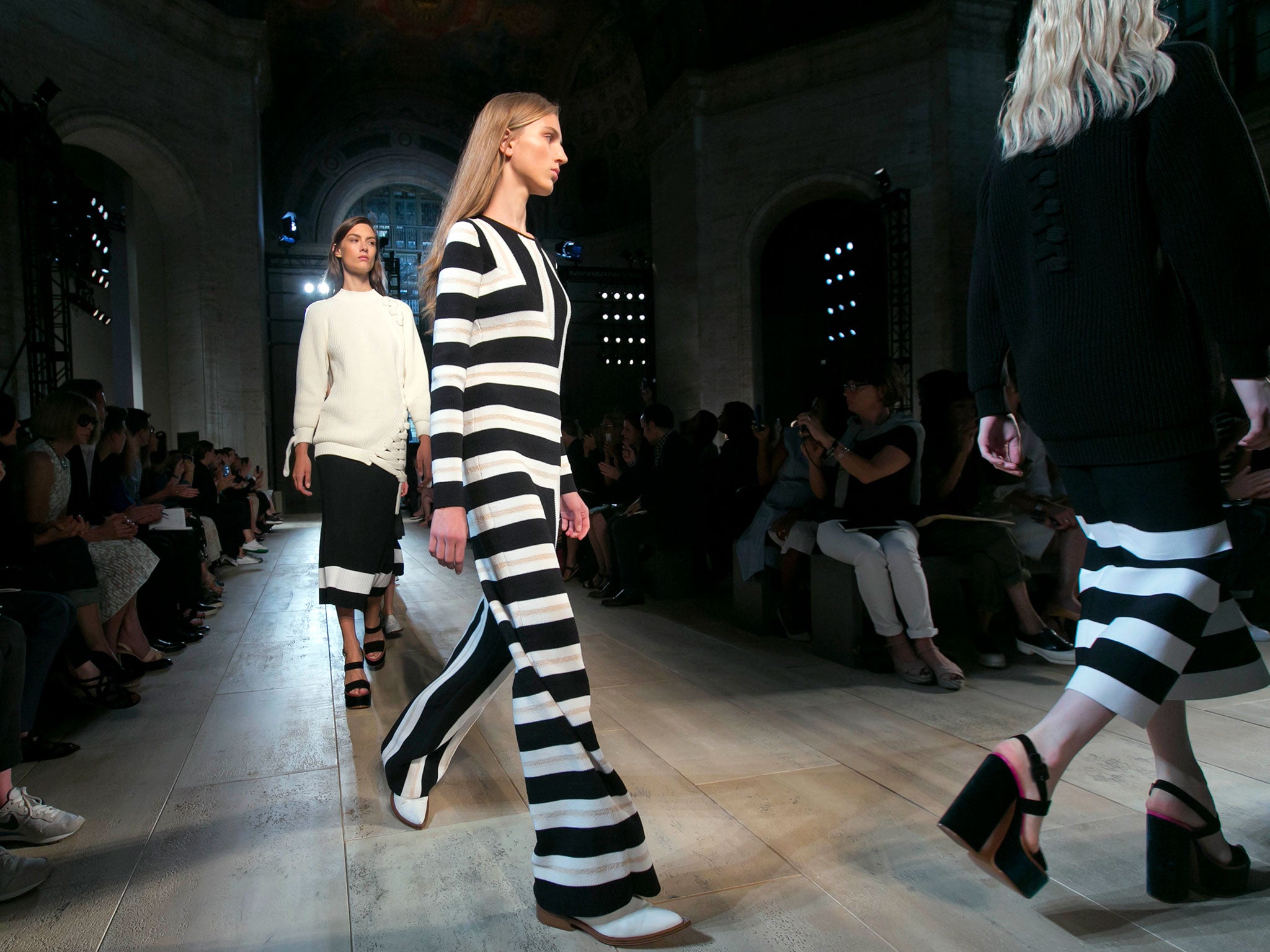 Models walk in the finale of the Victoria Beckham Spring 2015 collection