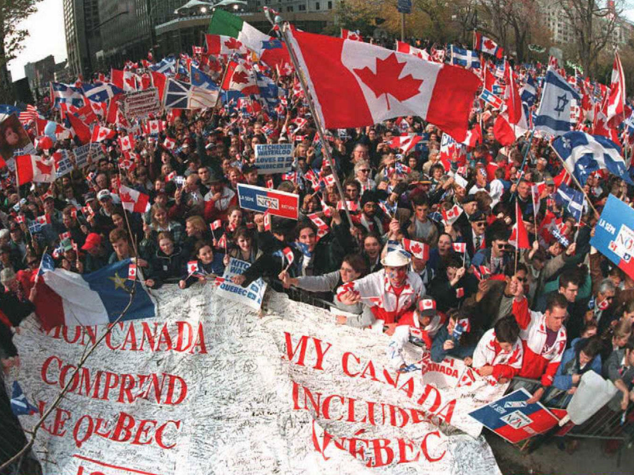 Thousands of Canadians urge Quebeckers not to go it alone in a rally in Montreal in 1995