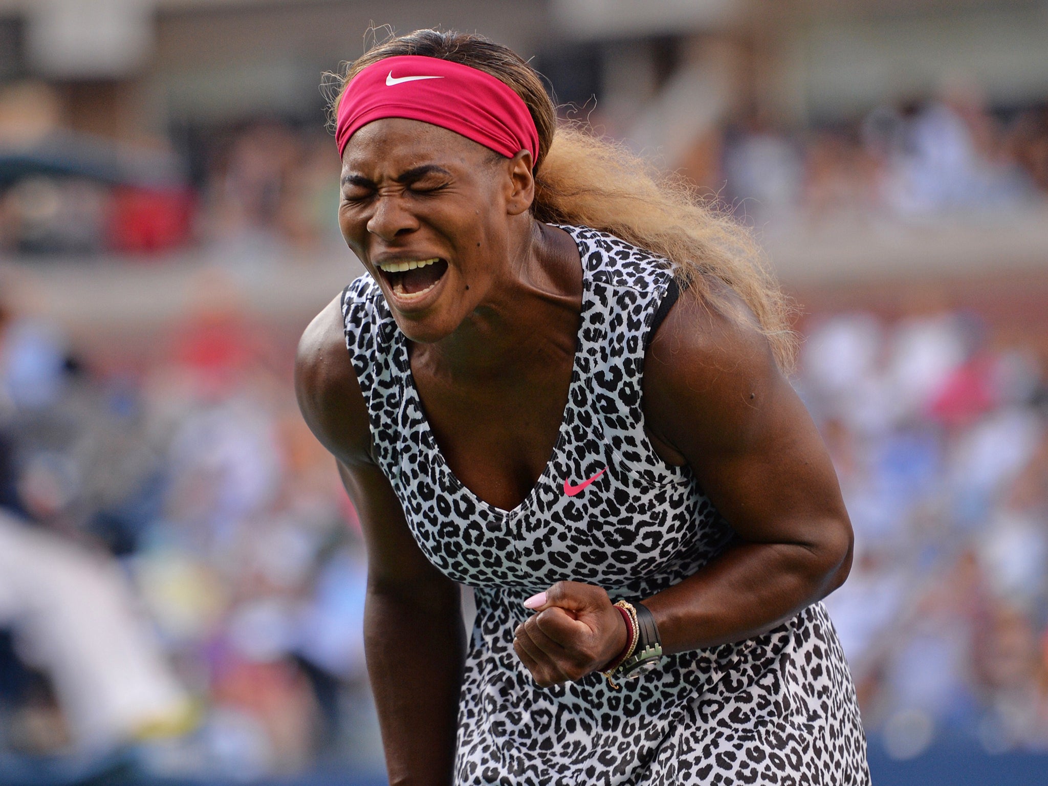 Serena Williams of the US reacts to a point against Caroline Wozniacki of Denmark during their US Open 2014 women's singles finals match at the USTA Billie Jean King National Center in New York