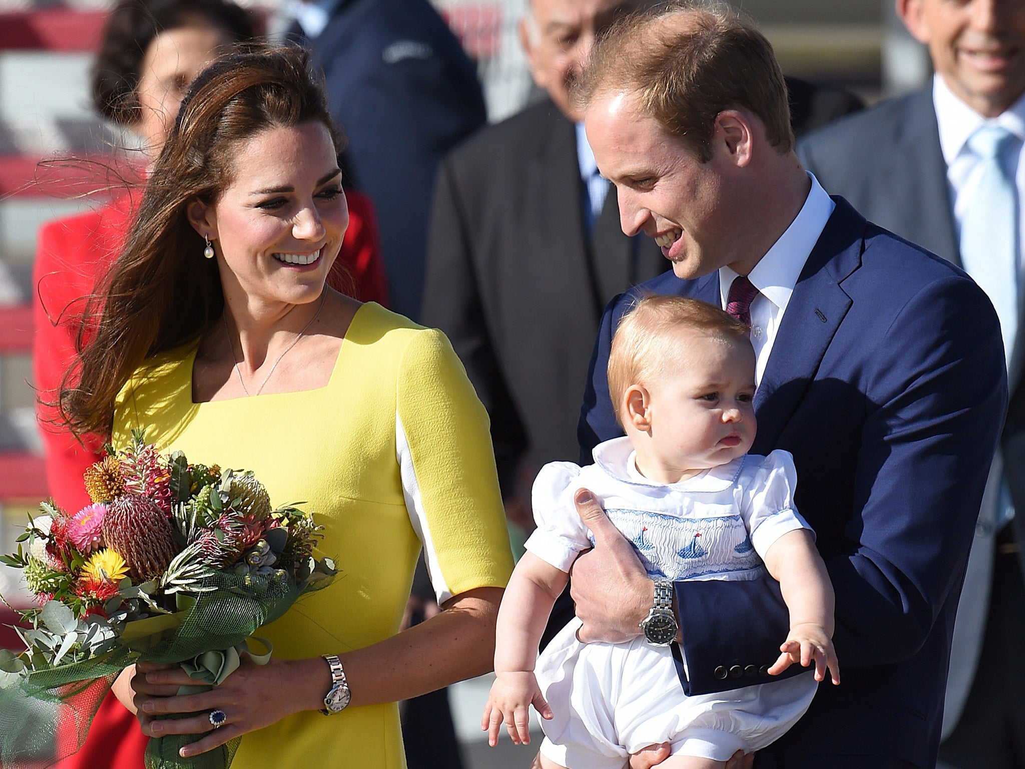 Prince William, (R) his wife Catherine, the Duchess of Cambridge (L) and their son Prince George