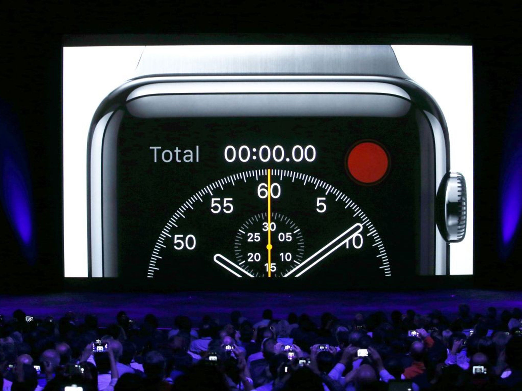 The crowd use their devices to capture the Apple Watch
