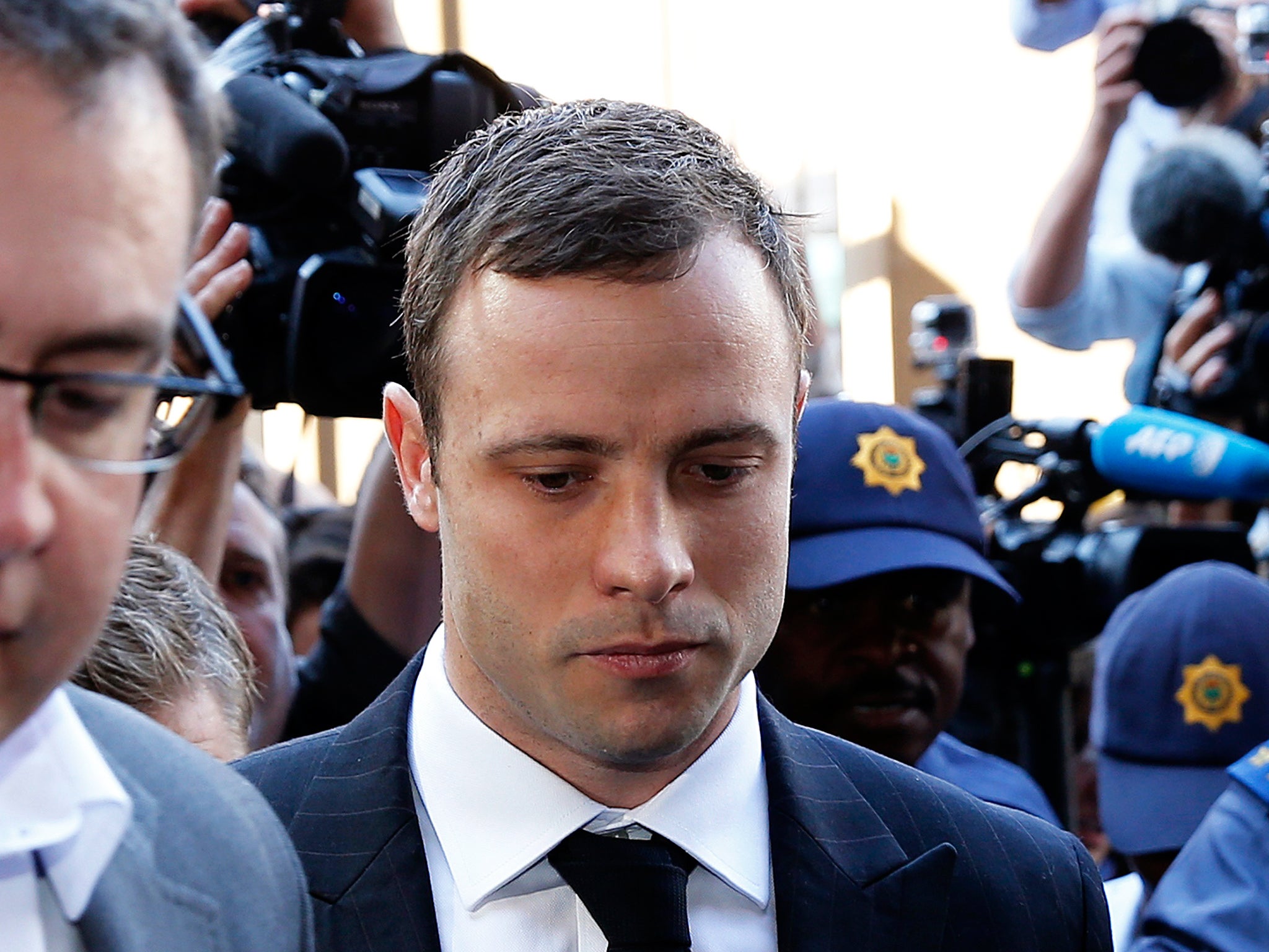 Oscar Pistorius arrives for the verdict in his murder trial at the high court in Pretoria