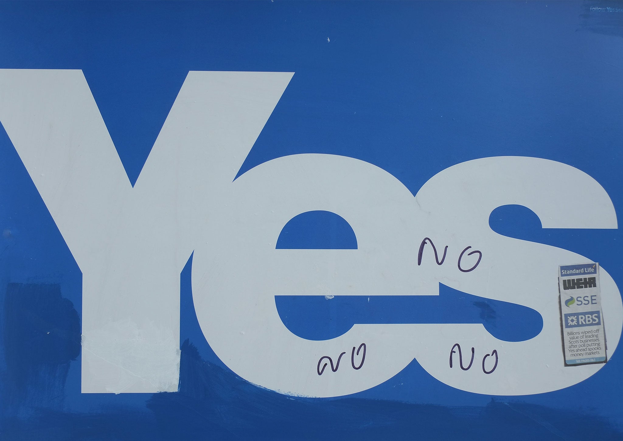 Yes campaign placards are placed in windows ahead of a visit by Liberal Democrat Deputy Prime Minister Nick Clegg