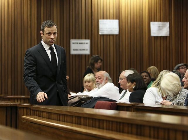 Oscar Pistorius walks past Reeva Steenkamp's family