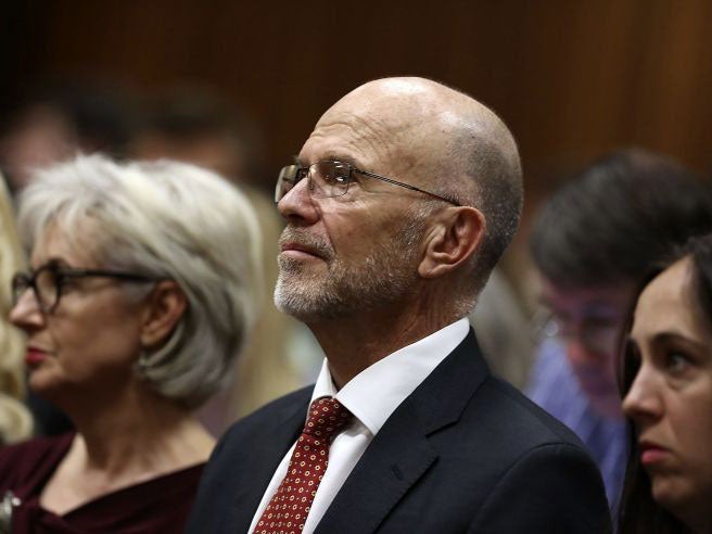 Arnold Pistorius, the uncle of Oscar Pistorius, listens to Judge Thokozile Masipa deliver her verdict on 12 September.