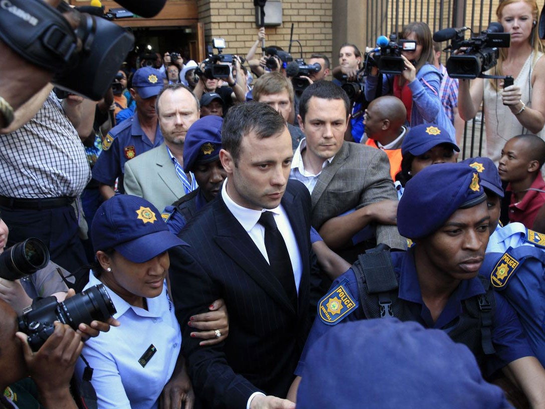 Oscar Pistorius leaving court on bail on 12 September