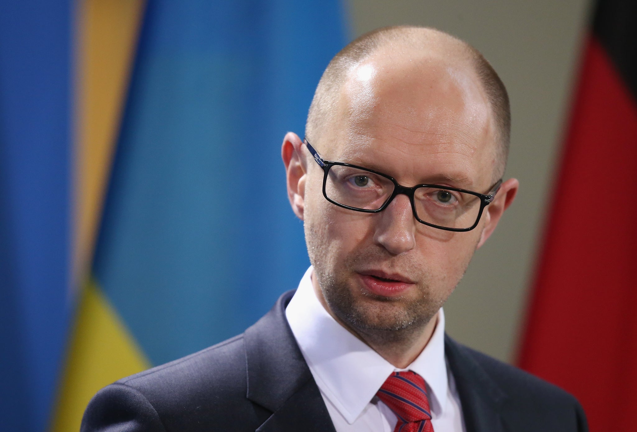 Ukrainian Prime Minister Arseniy Yatsenyuk has said Vladimir Putin want to "restore" the Soviet Union