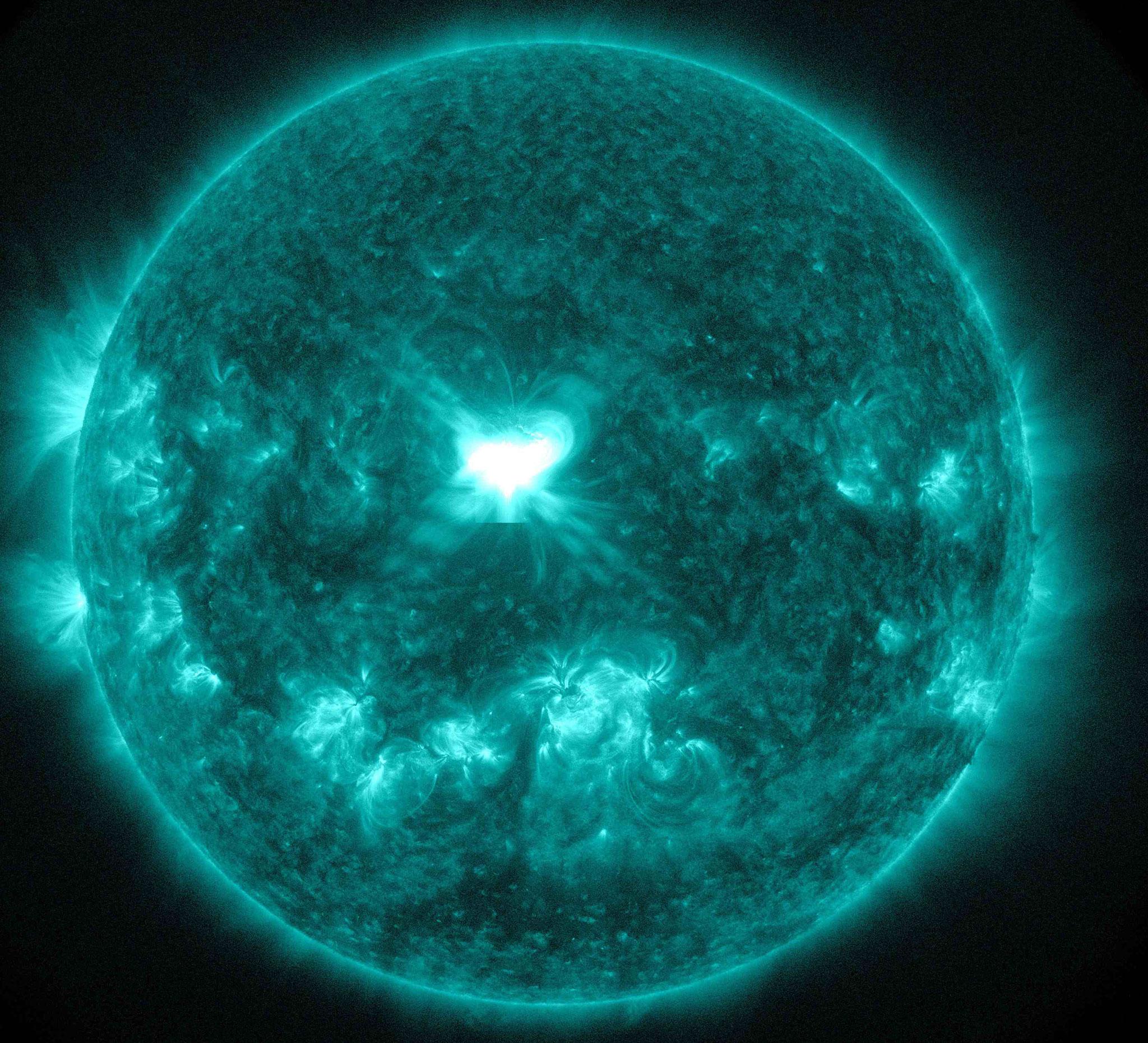 An X1.6 class solar flare flashes in the middle of the sun in this image taken 10 September, captured by NASA's Solar Dynamics Observatory