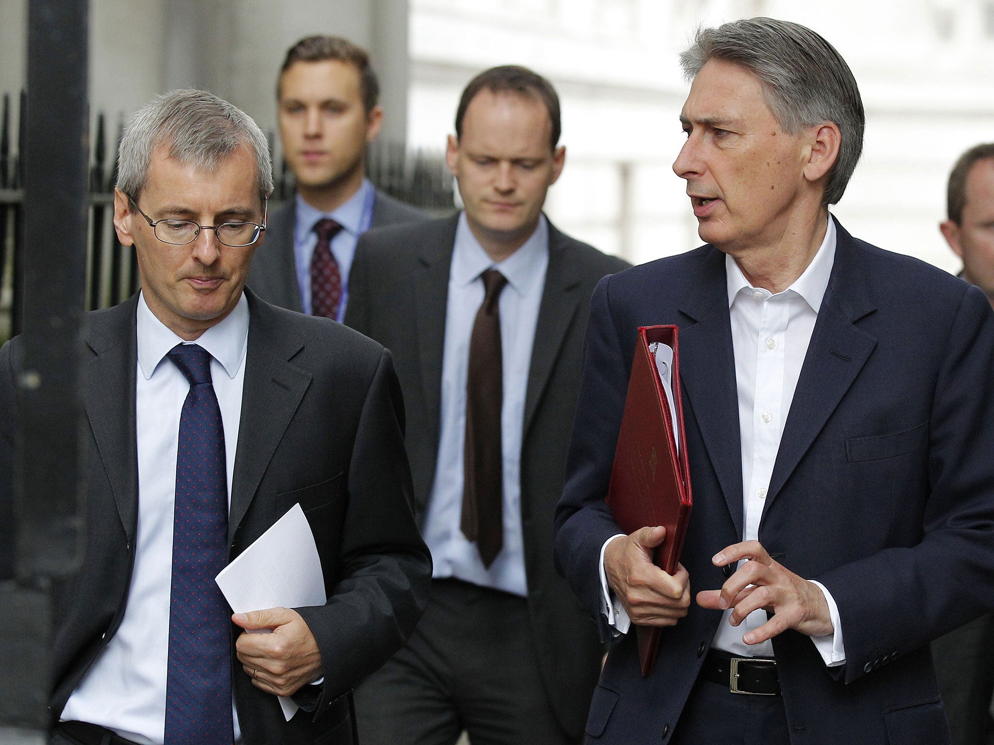 Foreign Secretary Philip Hammond (R) arrives for a meeting of the emergency response committee, Cobra, in Downing Street on Sunday morning