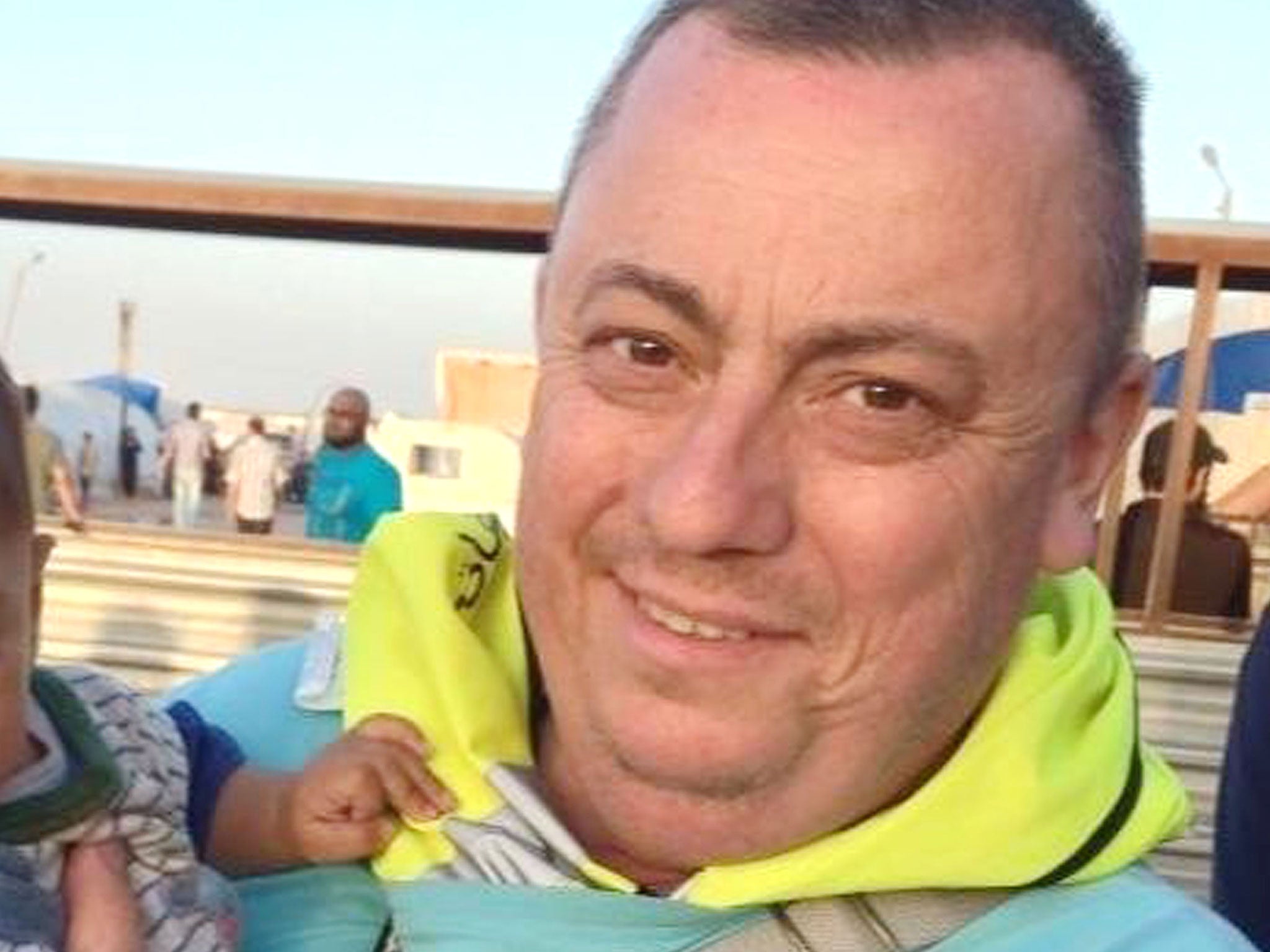 An undated handout photo released by the Foreign Office with the permission of his family, showing Alan Henning at a refugee camp on the Syrian-Turkish border