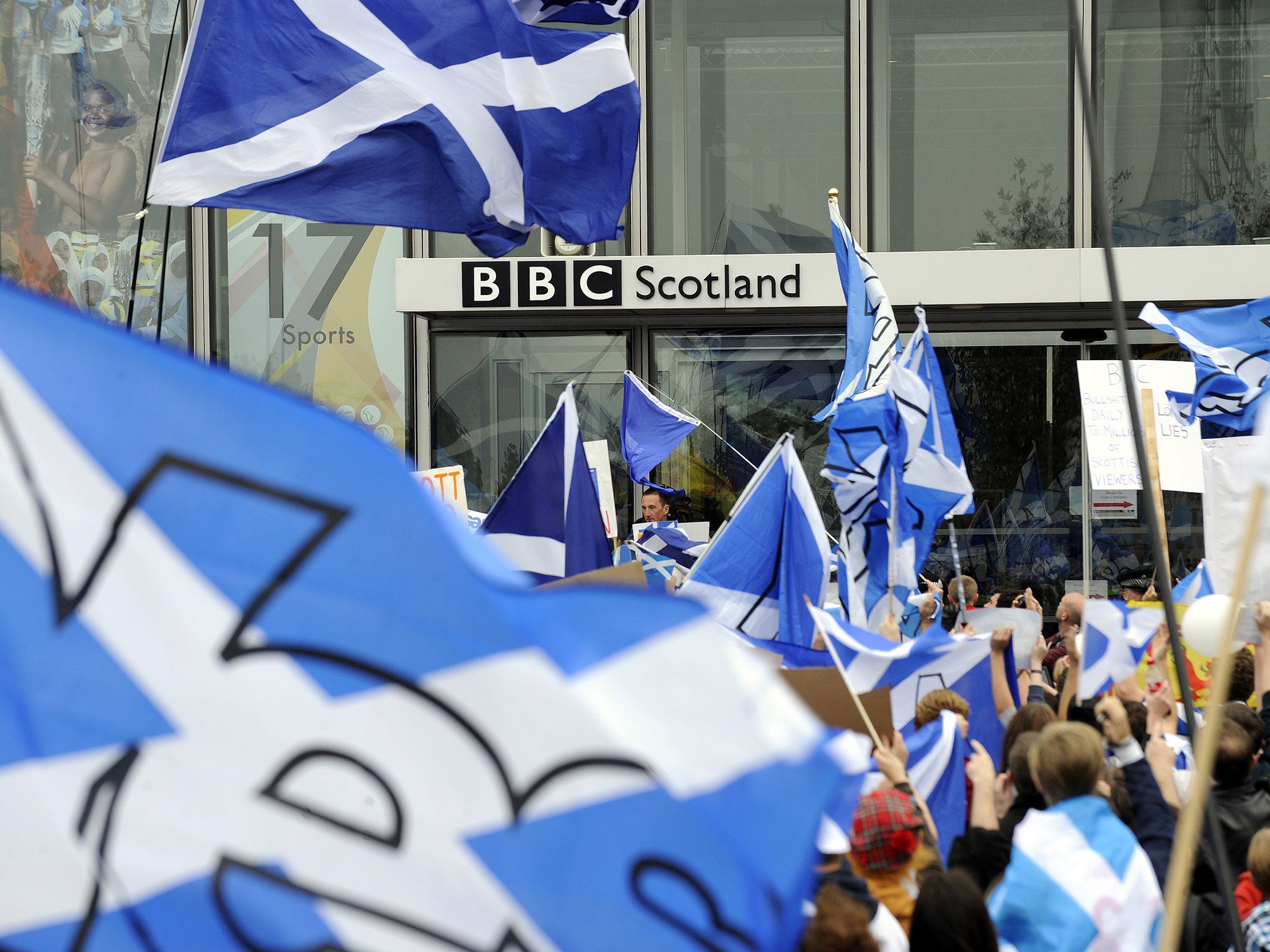 Pro-independence 'Yes' campaigners stage a demonstration outside the BBC Scotland Headquarters in Glasgow on 14 September, 2014