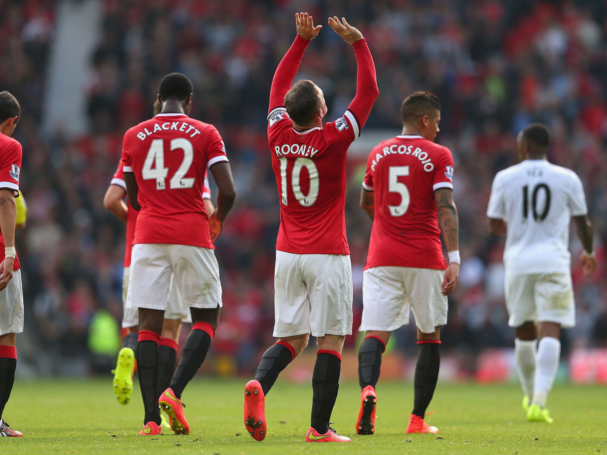 Wayne Rooney celebrates the third