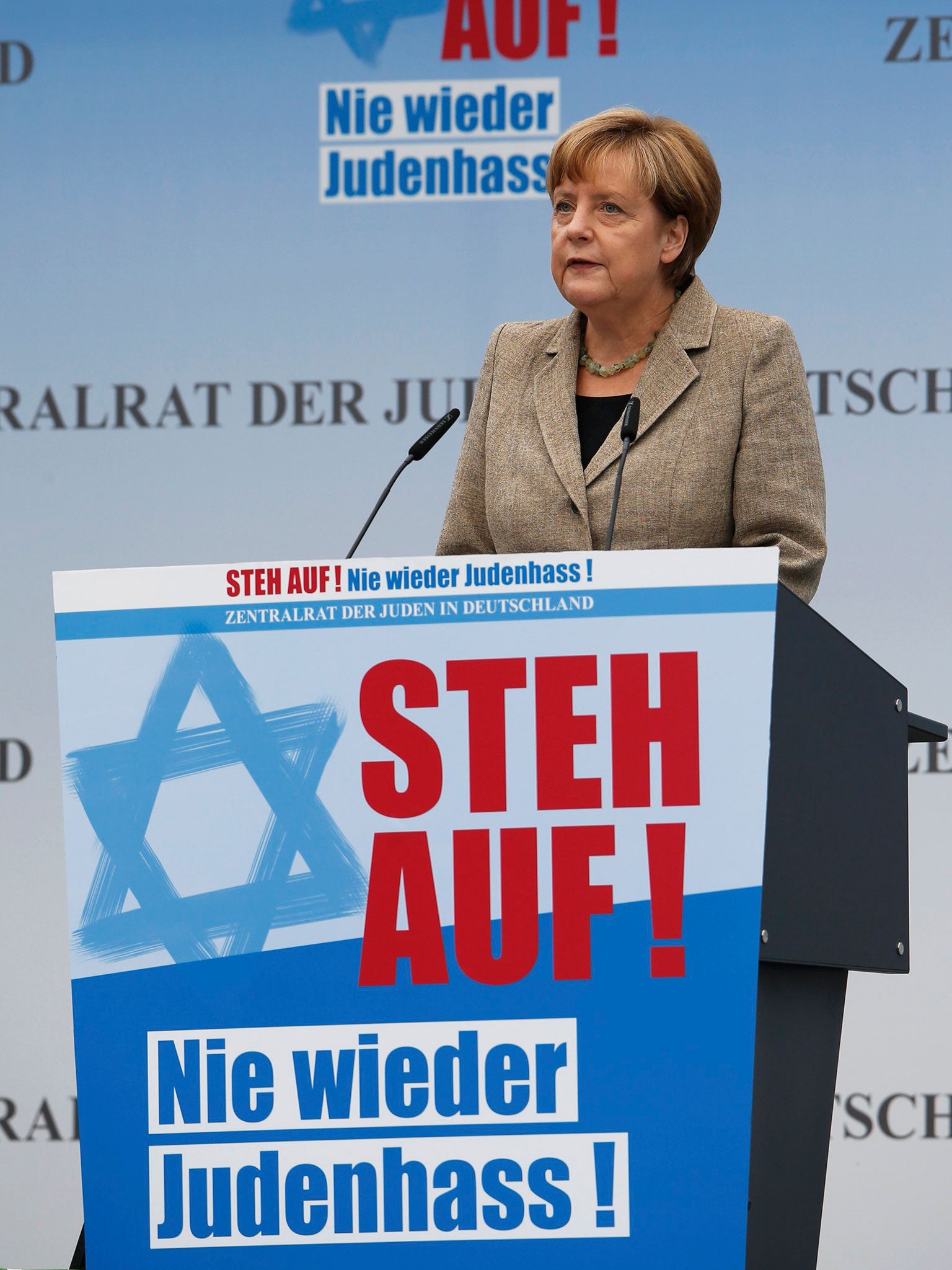 German Chancellor Angela Merkel addresses the anti-Semitism rally in Berlin