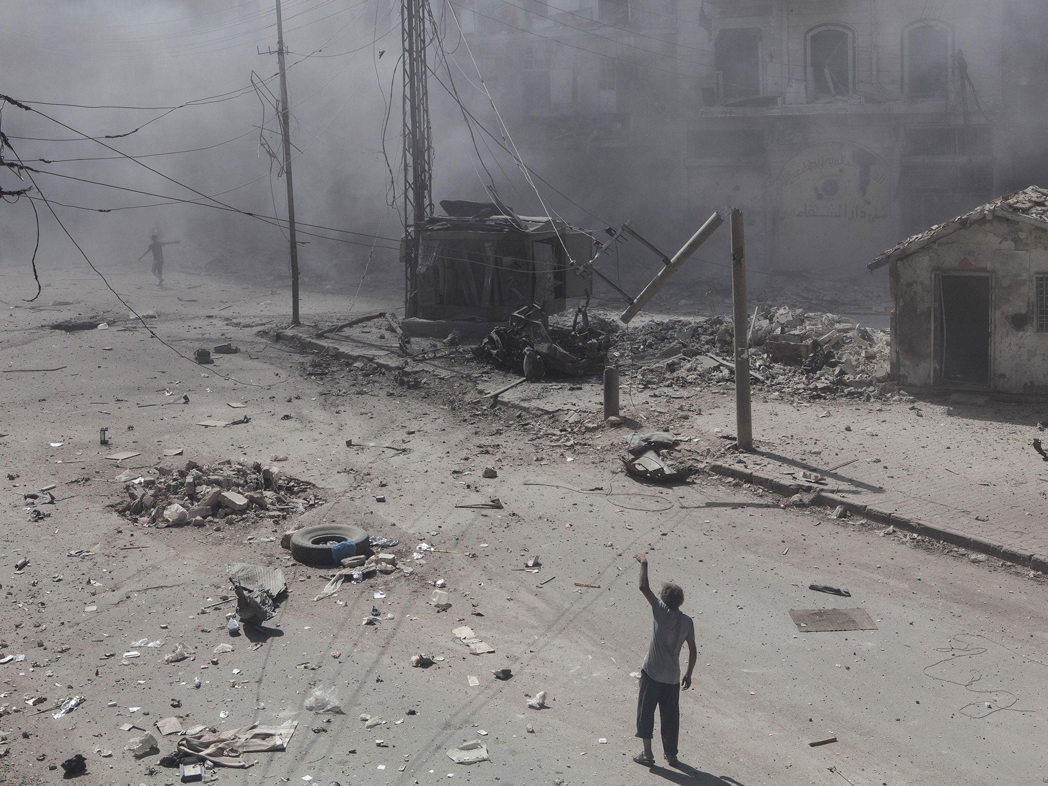 The aftermath of an airstrike on the Al Chaar neighbourhood in Aleppo in July. Syria has warned that action without the cooperation of its government would be a “big mistake” and a “big crime”