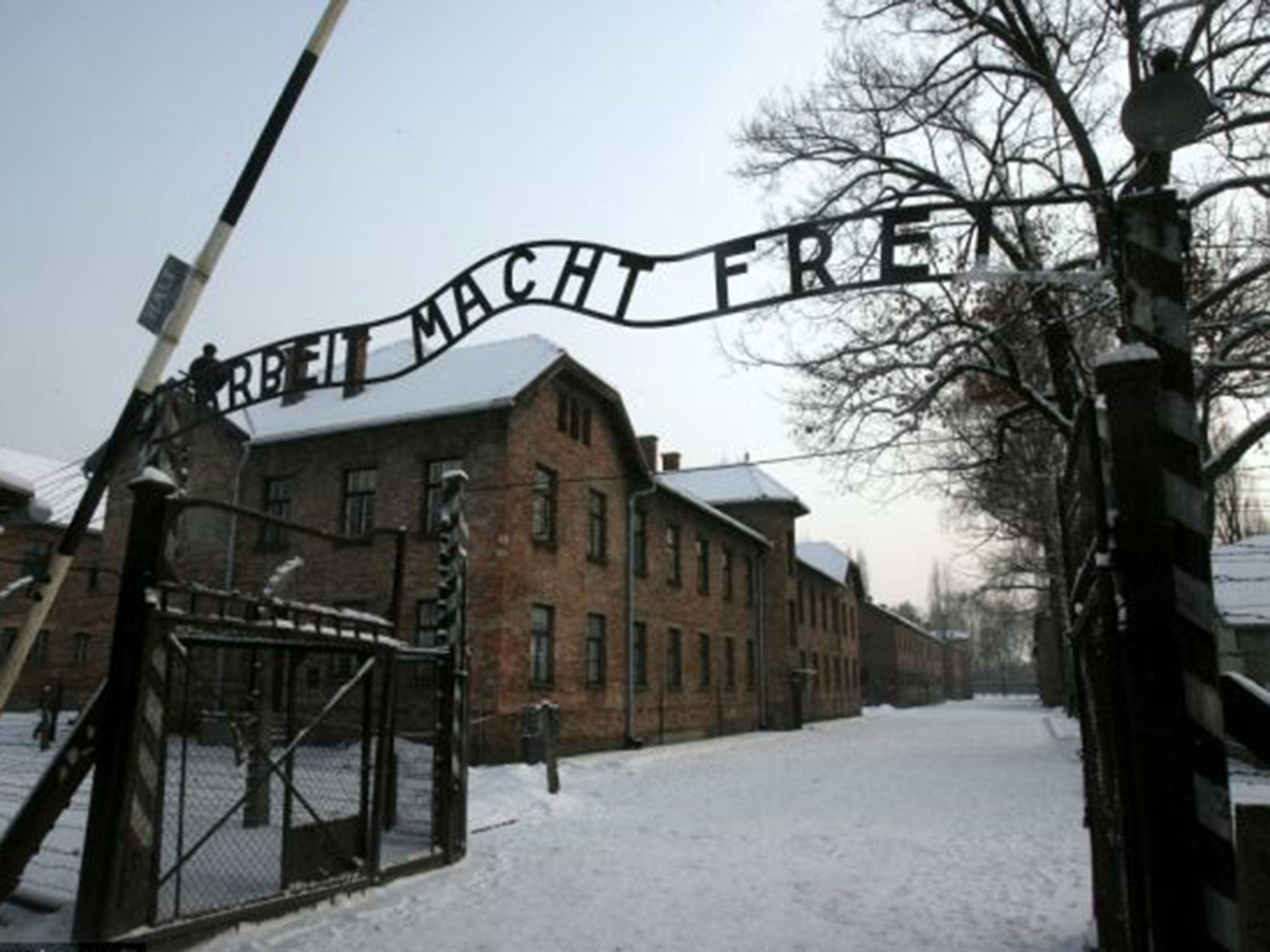 The main gate at Auschwitz. The inscription reads: 'Arbeit macht frei' - 'Work Makes Free' or 'Work Liberates' (Getty)