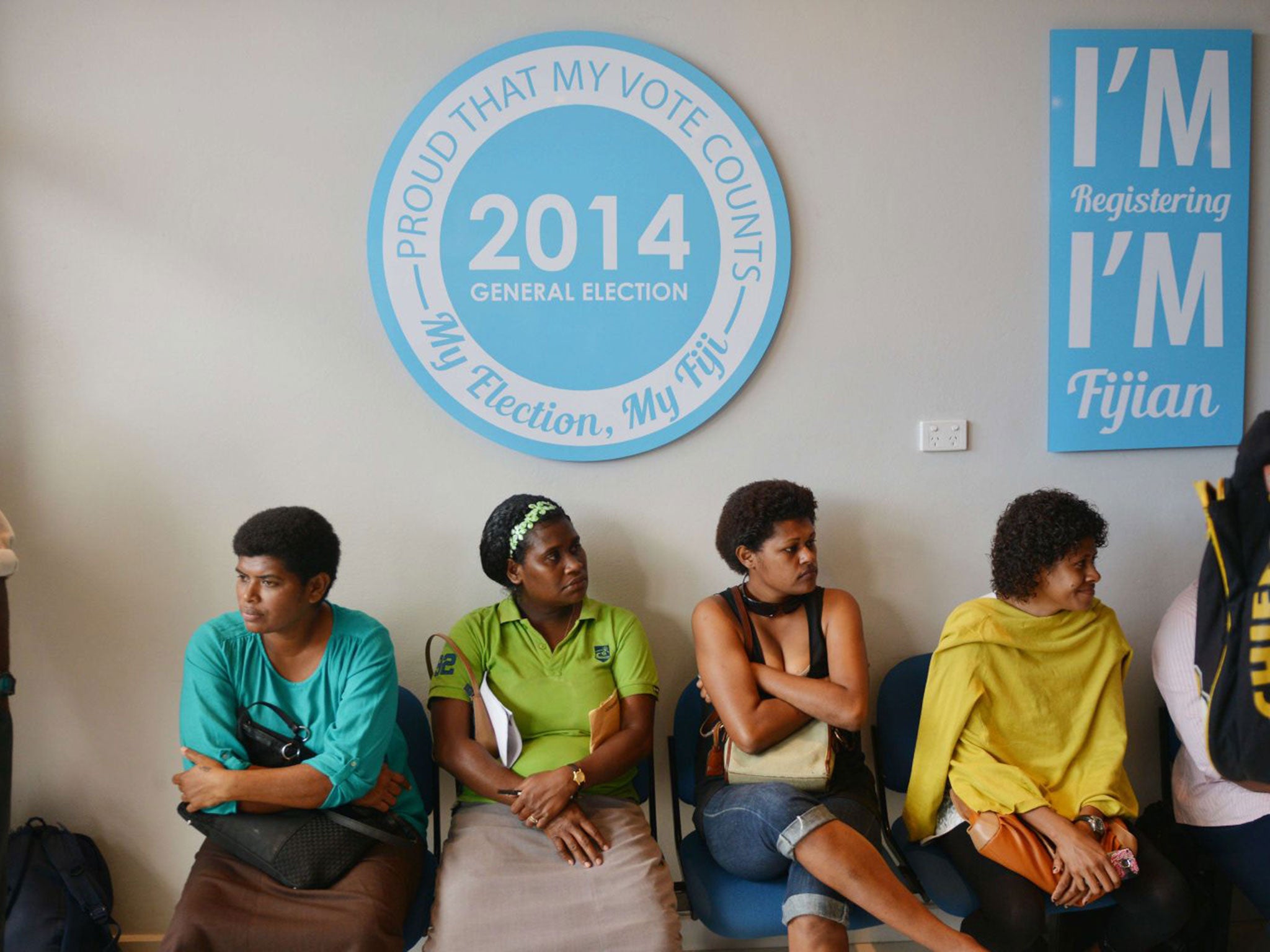 People wait to have lost election cards replaced at the election office for the upcoming elections in Suva, the capital. Fiji has imposed a strict media blackout of coverage of the South Pacific nation's first elections since a 2006 military coup, warning