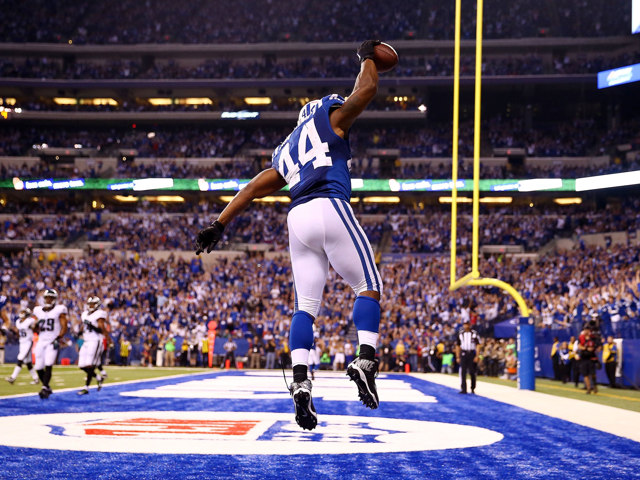 Colts running-back Ahmad Bradshaw celebrates a touchdown in flying style