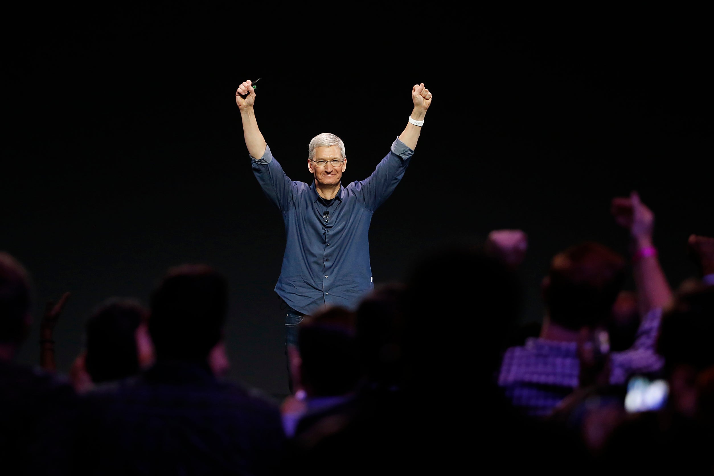 Tim Cook salutes the audience at the unveiling of the iPhone 6 and iPhone 6 Plus at an event in California earlier this month