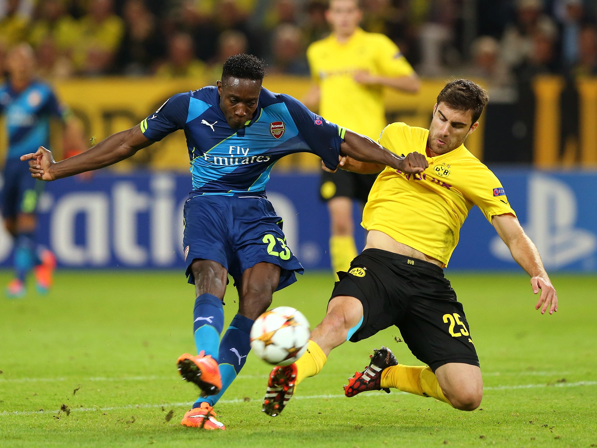 Danny Welbeck of Arsenal holds off the challenge from Sokratis Papastathopoulos