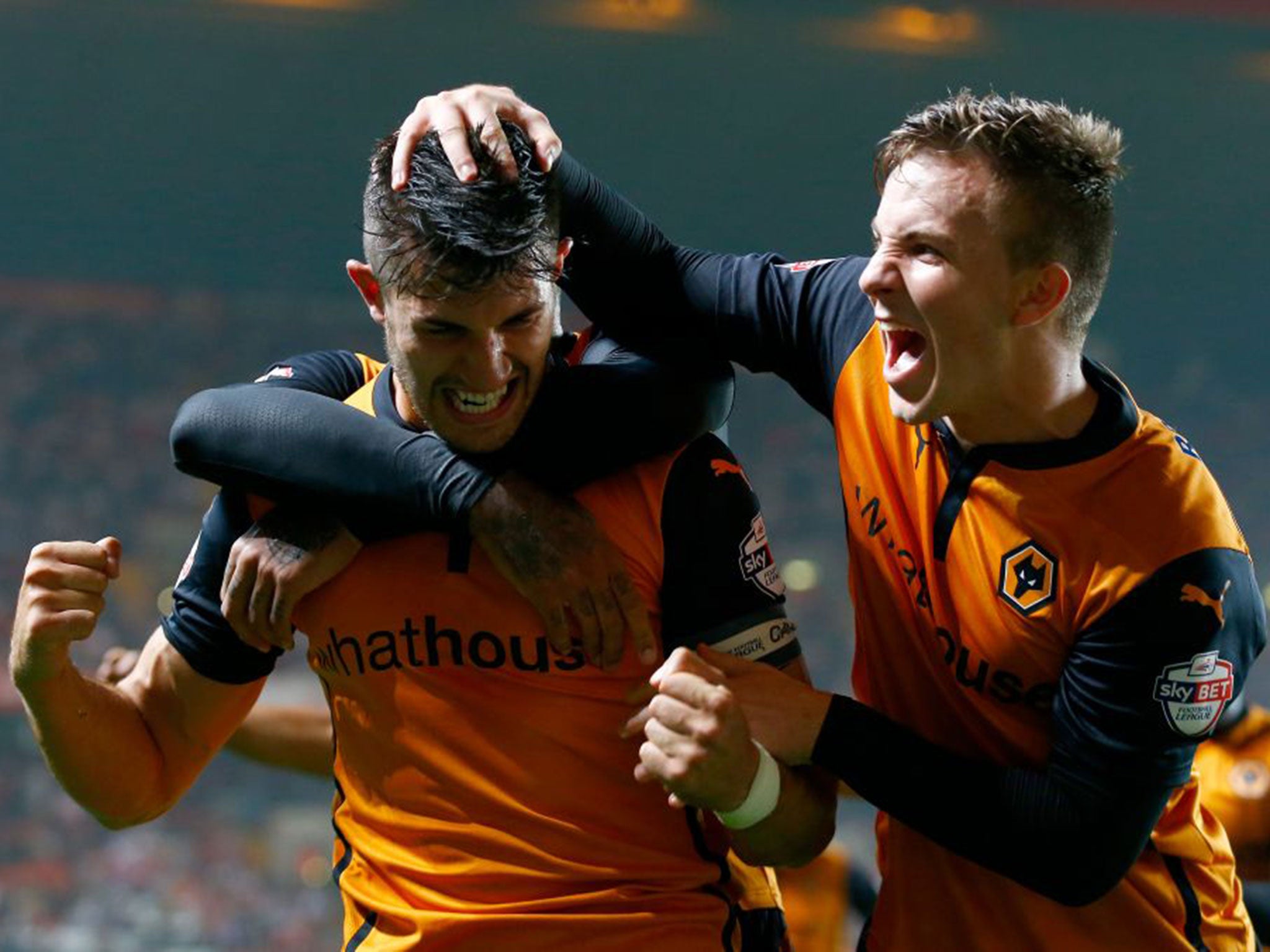 Danny Batth, left, celebrates his equaliser for Wolves at Charlton