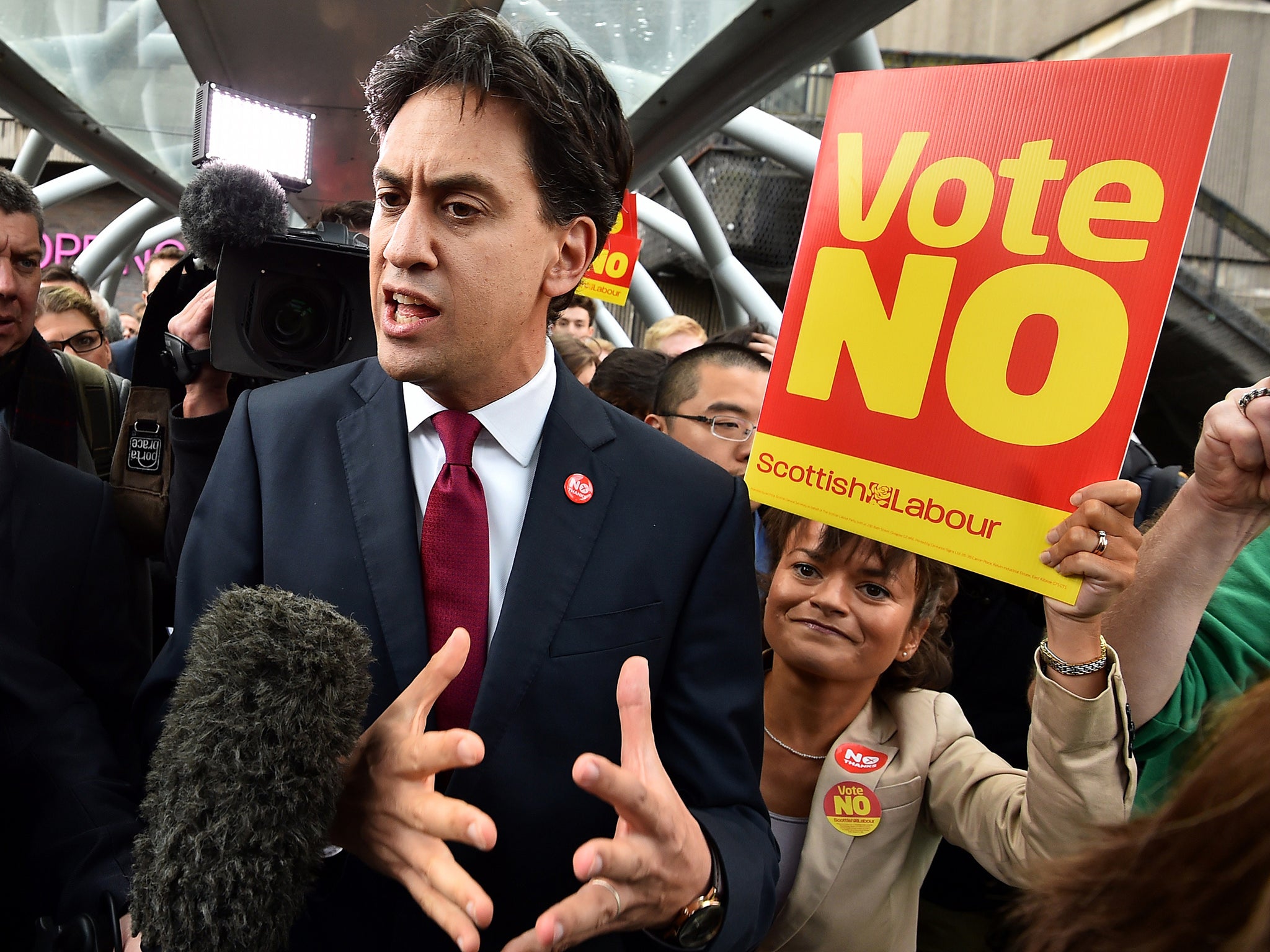 Labour Party leader Ed Miliband addresses the public and media as he walks in Edinburgh