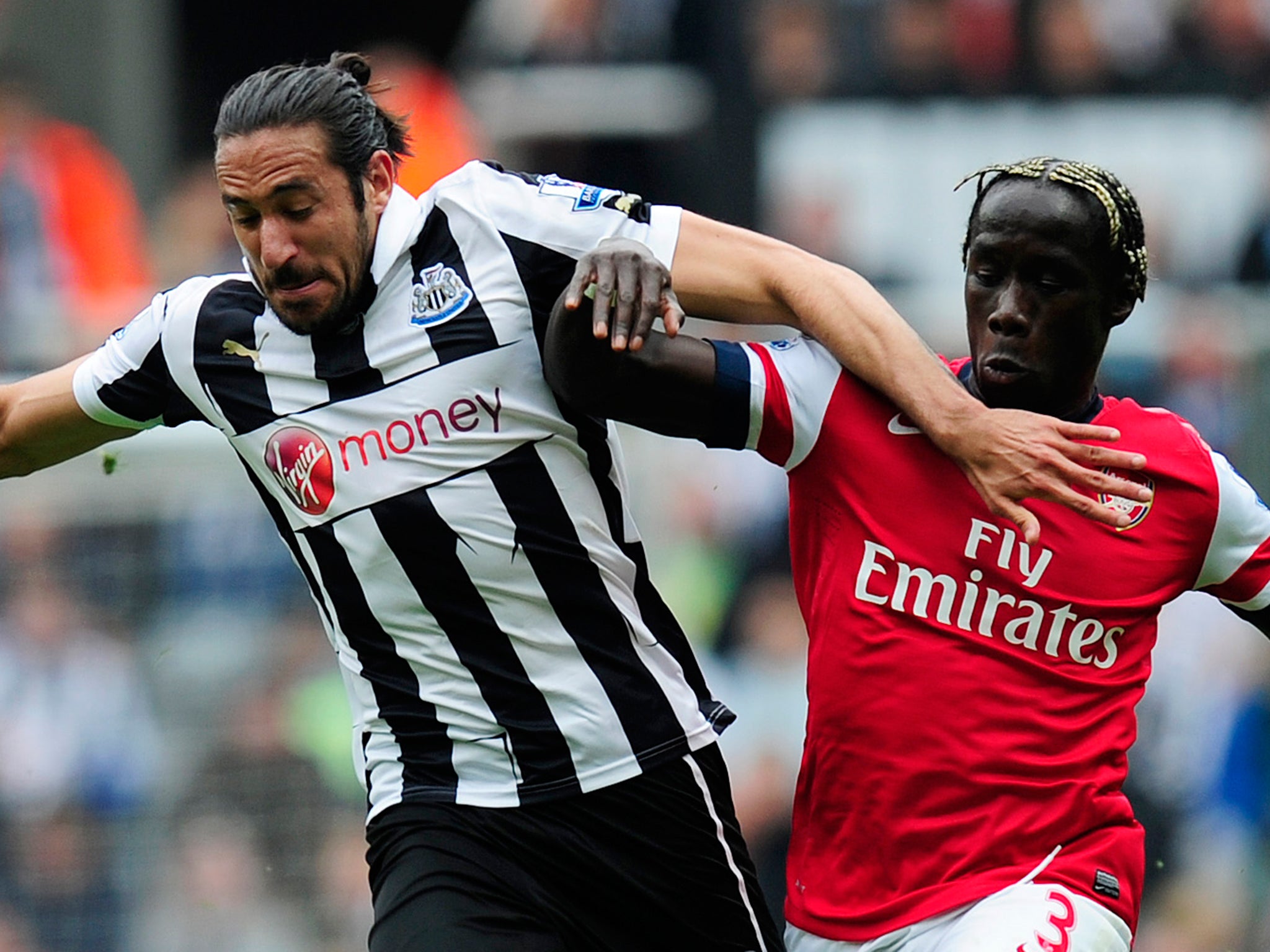 Gutierrez and Sagna battle for the ball