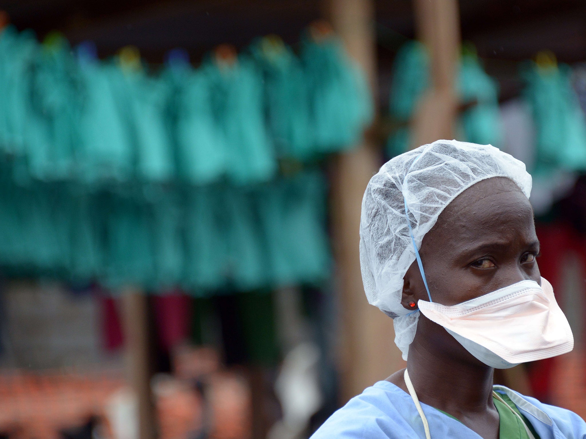 A health worker stands at Elwa hospital in Monrovia